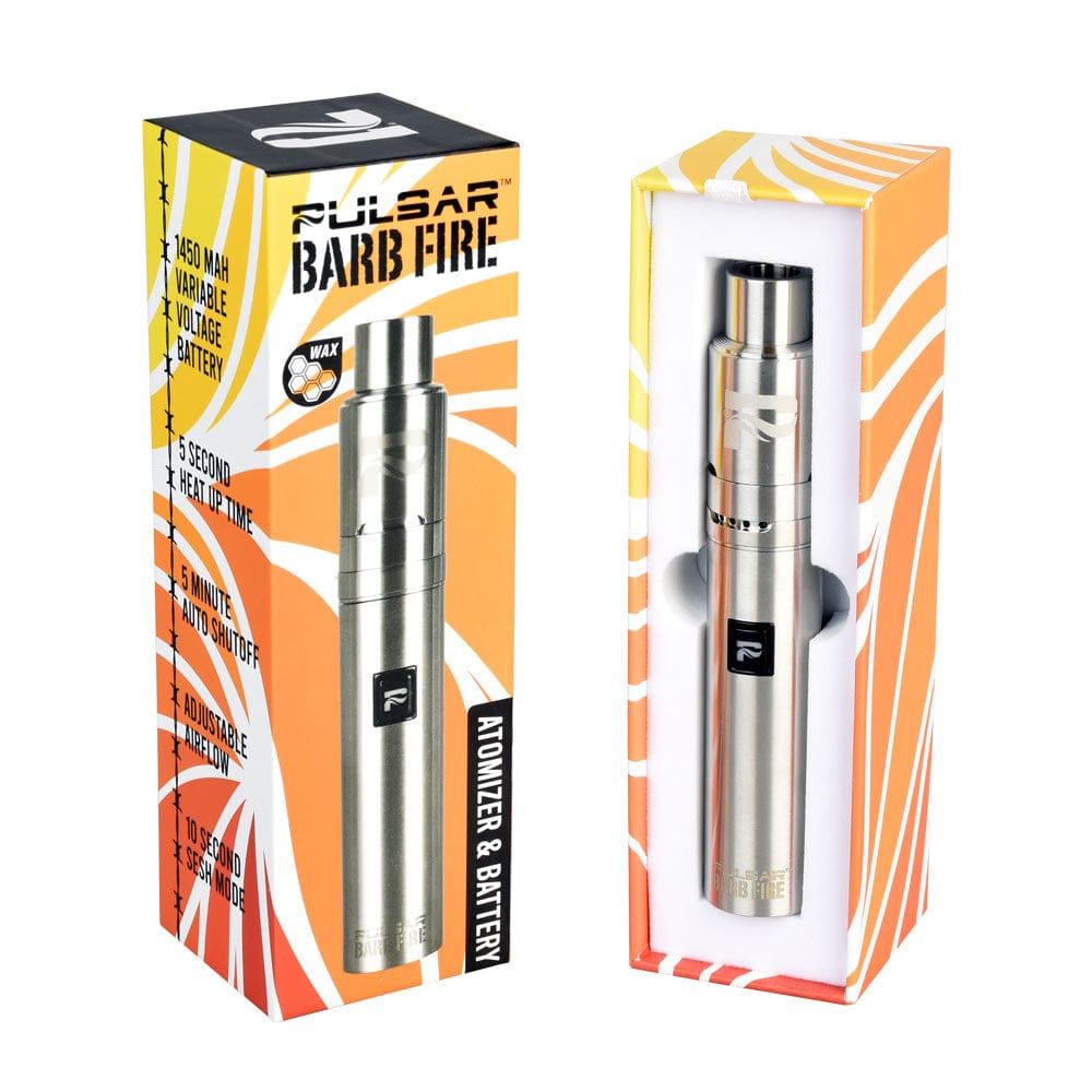 Angled front view of the Pulsar Barb Fire Variable Voltage Wax Vaporizer standing in its orange-and-white branded box next to the open foam-lined packaging showing the stainless steel device.
