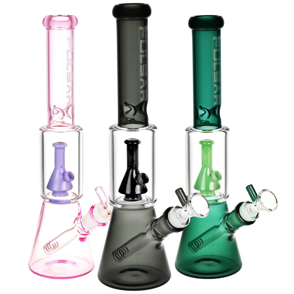 Front-facing trio of Pulsar Beaker On Beaker Bong - 11.5"/14Mm F/Colors Vary showing pink, smoky, and green models on white.