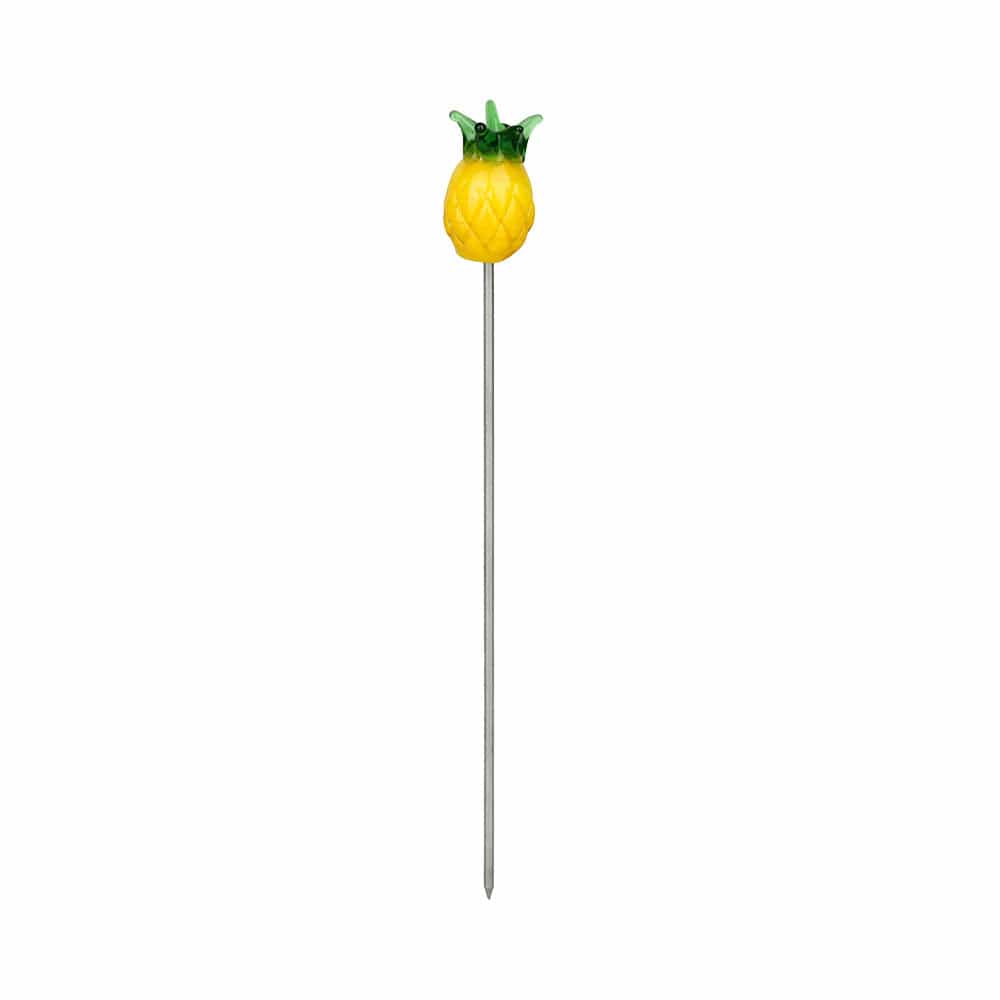 Center-frontal view of a long metal pick topped with a small yellow-and-green pineapple glass head, the Pulsar Fruit Series Pineapple Express Herb Pipe Glow Duo - 10" / 14Mm F.