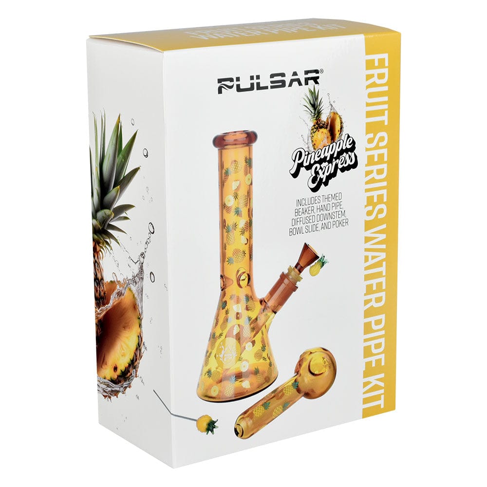Angled product shot of the Pulsar Fruit Series Pineapple Express Herb Pipe Glow Duo - 10" / 14Mm F box showing a yellow pineapple-patterned beaker and matching hand pipe on a white background.