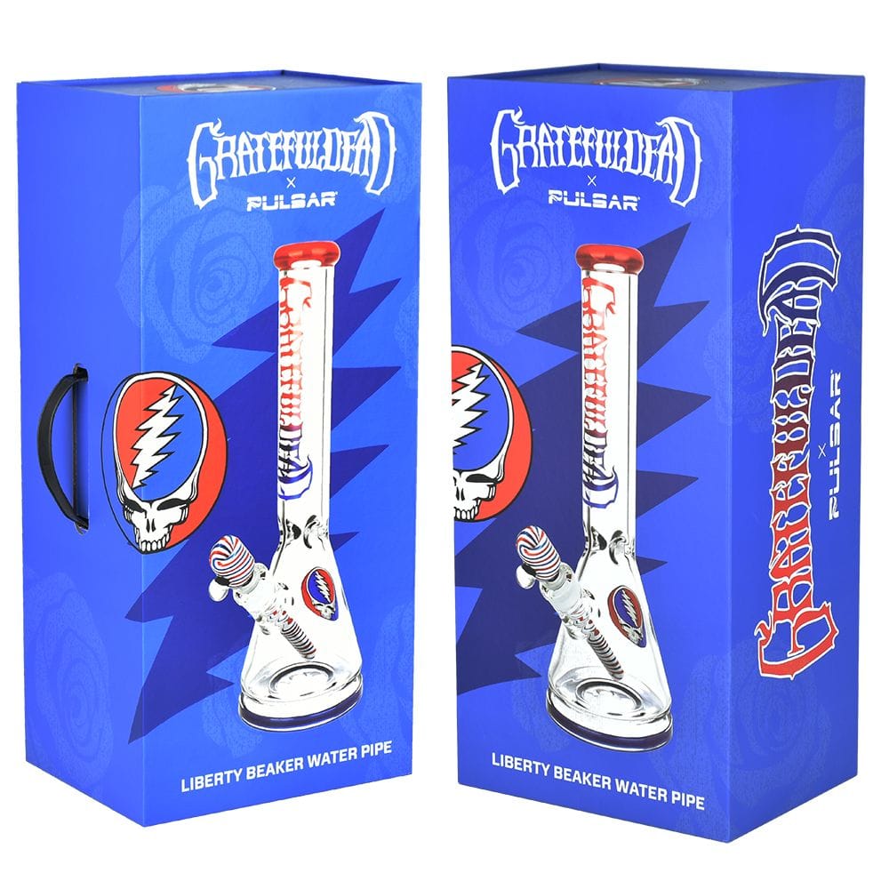 Front-facing product box duo showing the Grateful Dead X Pulsar "Liberty Beaker" Bong - 15.75" / 14Mm F artwork with a clear beaker image and blue background.