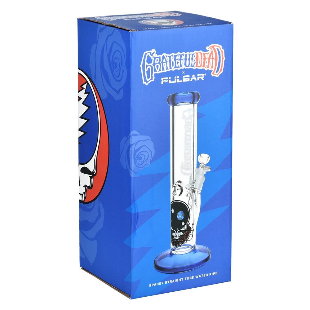 Boxed, front three-quarter view of the Grateful Dead X Pulsar Space Your Face Straight Tube Glass Bong - 11.75" / 14Mm F, showing blue packaging with skull graphic and product image.