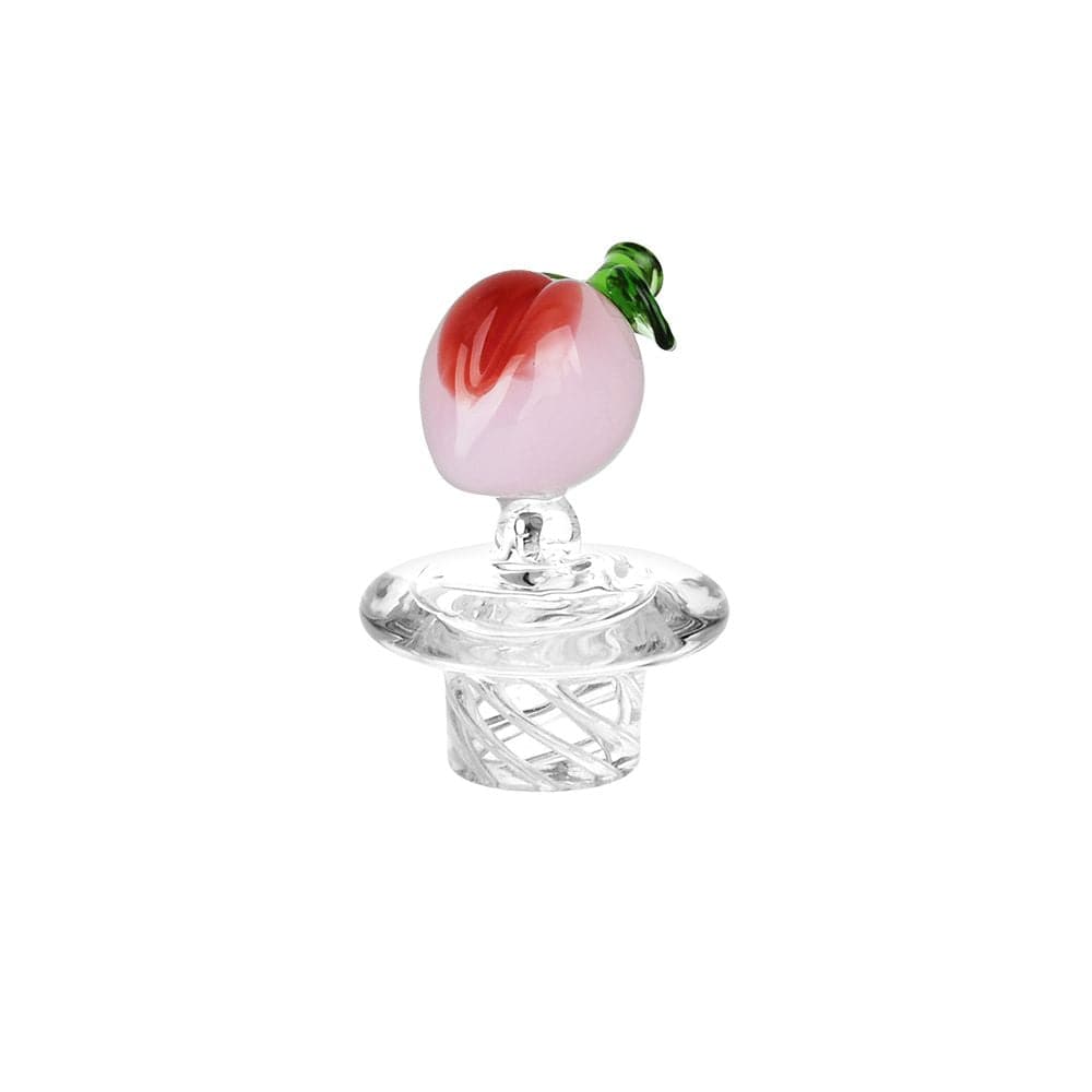 Centered studio shot of the Pulsar Fruit Series Peaches & Cream Glow In The Dark Dab Rig Kit - 8" / 14Mm F showing a small pink-and-red peach glass topper with a green stem atop a clear swirled glass joint piece.