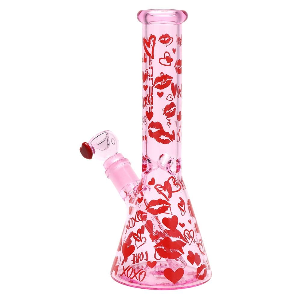 Front view of the pink 10" Pulsar Valentine'S Xoxo Glass Beaker Water Pipe & Hand Pipe Set - 10" / 14Mm F decorated with red lips and hearts on a white background.