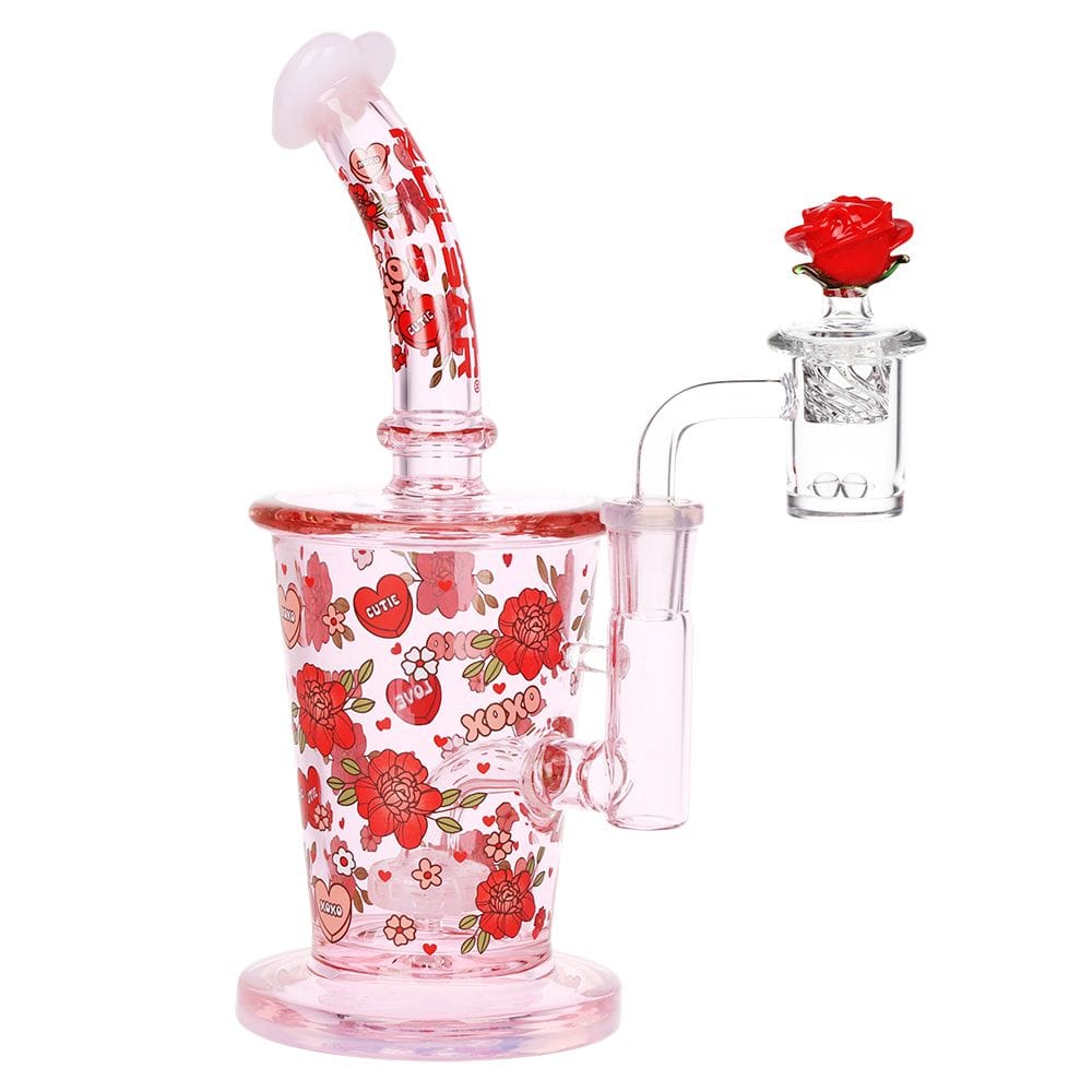 Front view of the Pulsar Valentine'S Rose Glass Dab Rig Set - 8.25" / 14Mm F showing a pink glass rig decorated with red roses and heart motifs and a clear side banger topped by a red glass rose