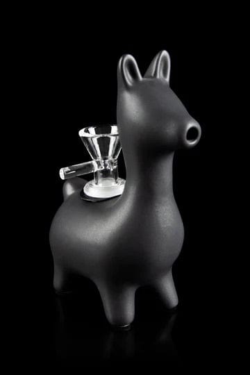 Front view of the Alpaca Bubbler, a white ceramic piece shaped like an alpaca with a smoking bowl forming its head.