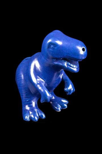 Front view of the Dino Pipe, a blue, dinosaur-shaped pipe against a black background.