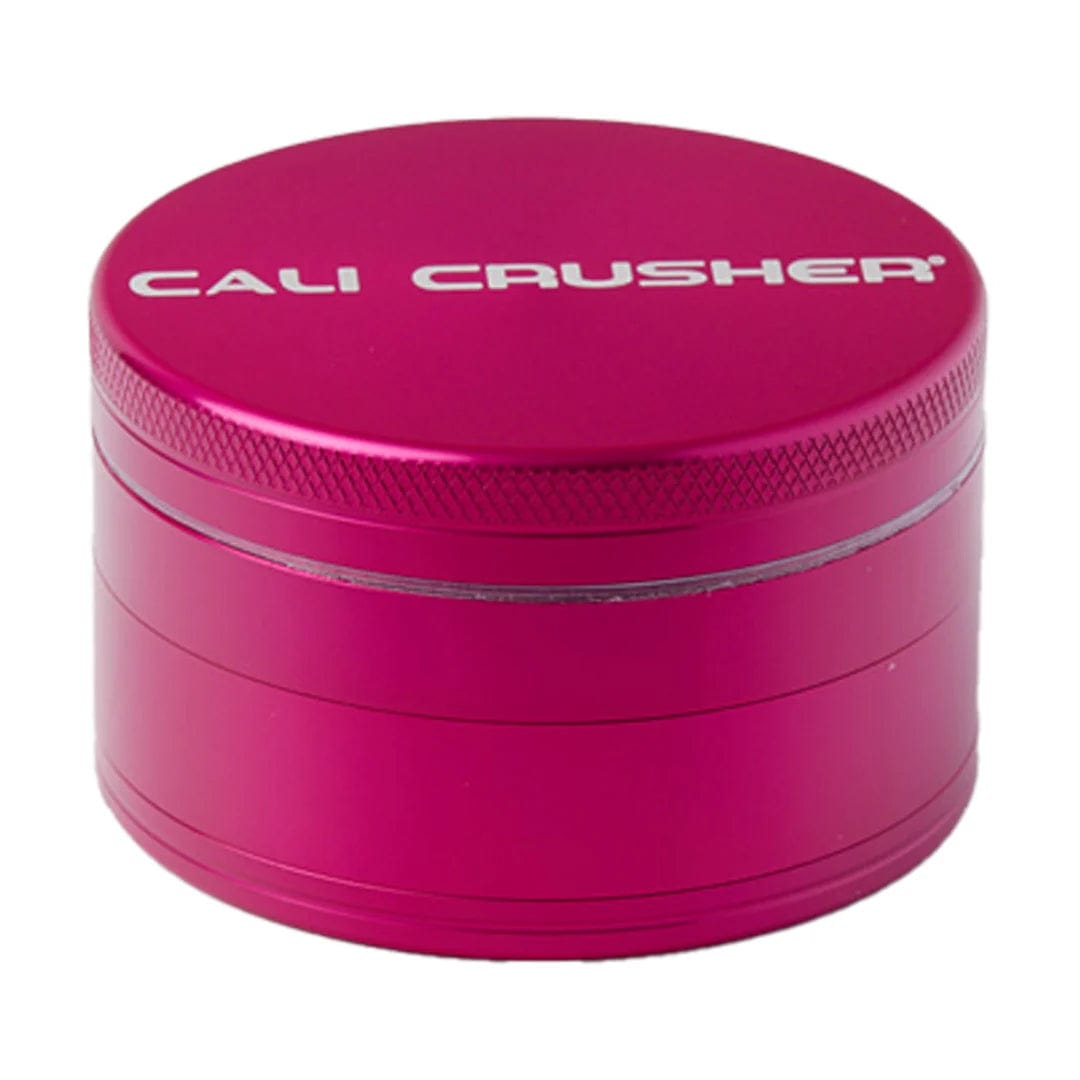 Front view of the Cali Crusher O.G Grinder, a metallic purple four-piece grinder with a textured, cylindrical design.