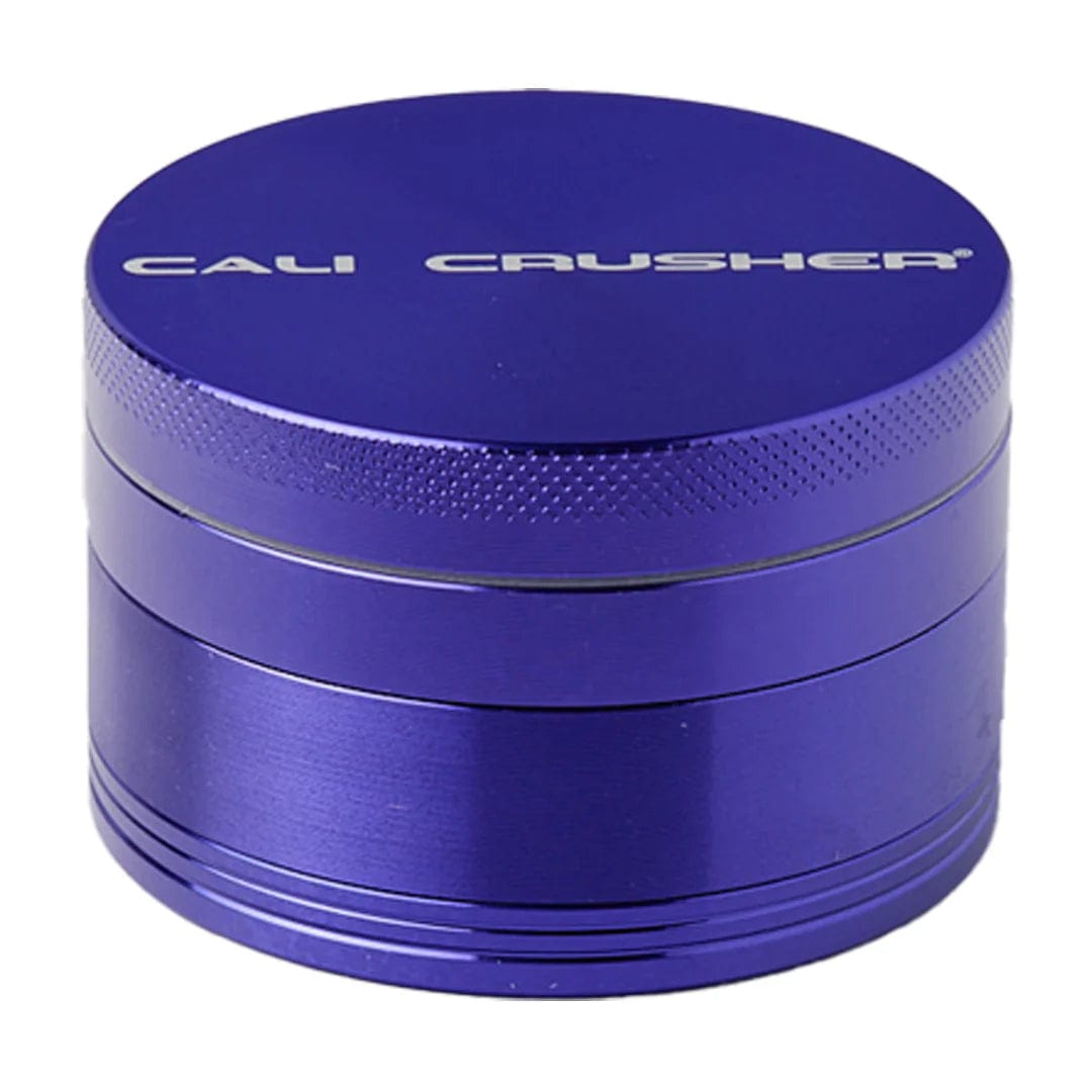 A front view of the Cali Crusher O.G Grinder, a four-piece, 2.5-inch metal grinder with a sleek, cylindrical design.