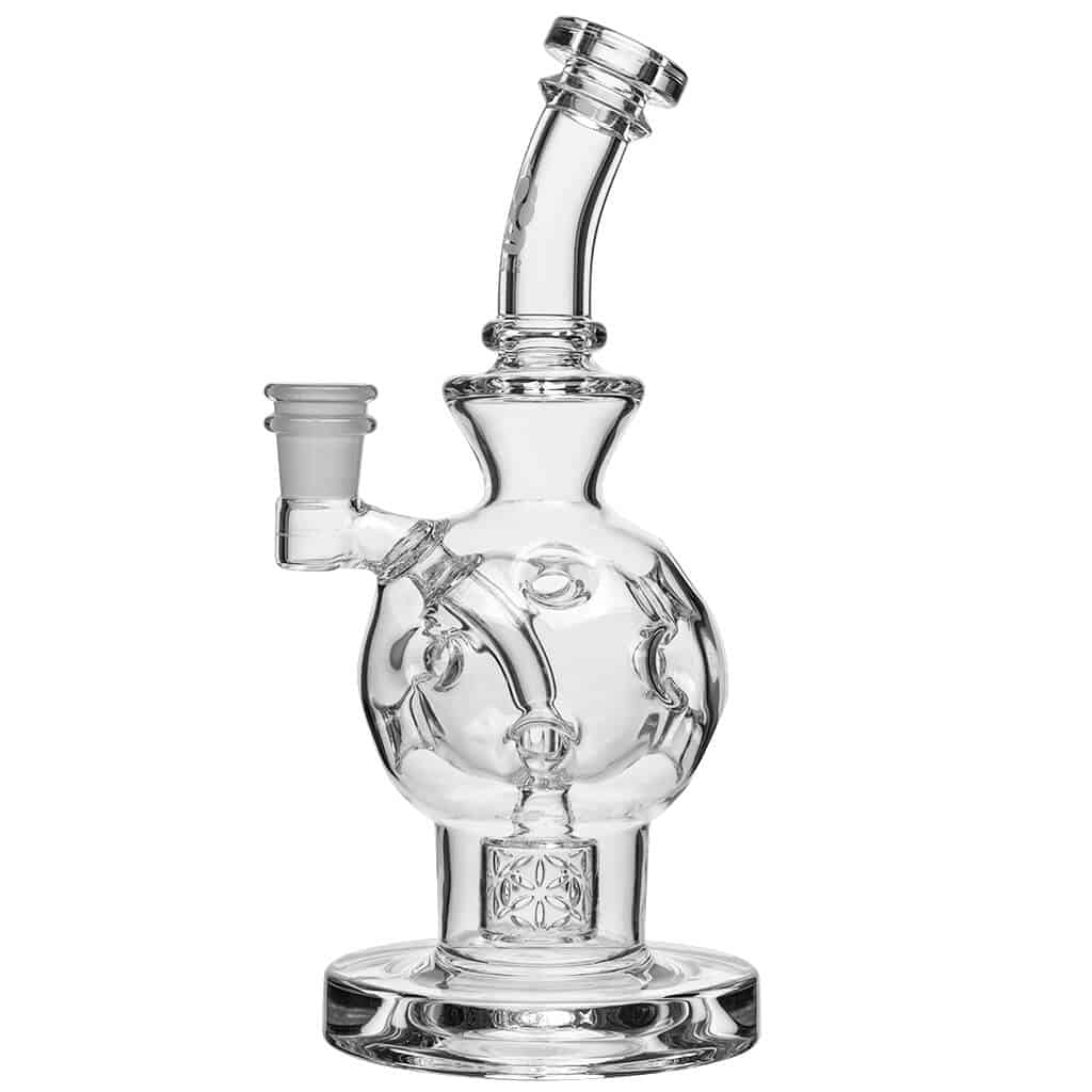 The EXOSPHERE showcases a clear glass bubbler with a unique, rounded shape and visible joint detail in a studio lighting setup.
