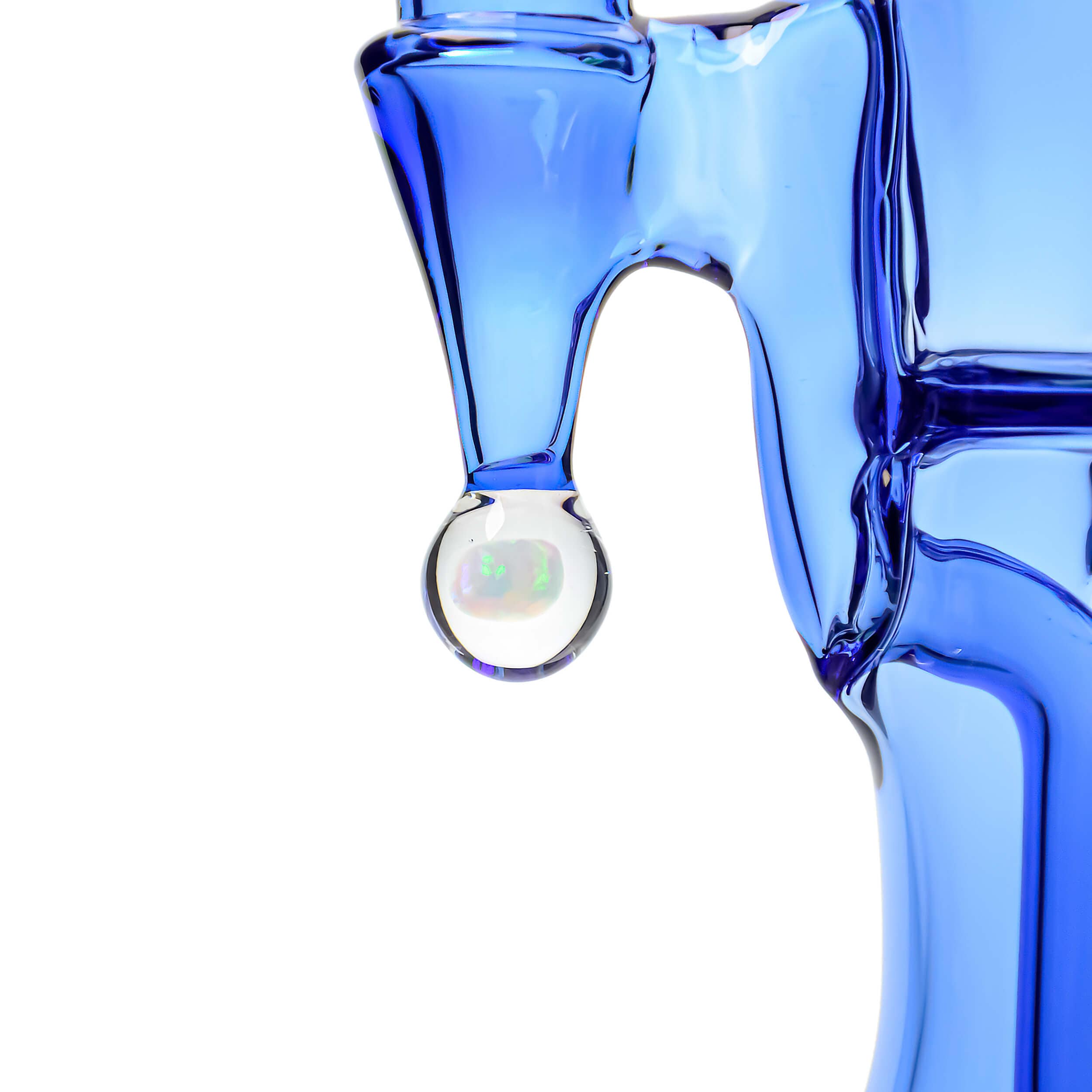 Front view of the COLORED OPAL SHOWERHEAD RECYCLER, showcasing its blue glass and unique showerhead design.