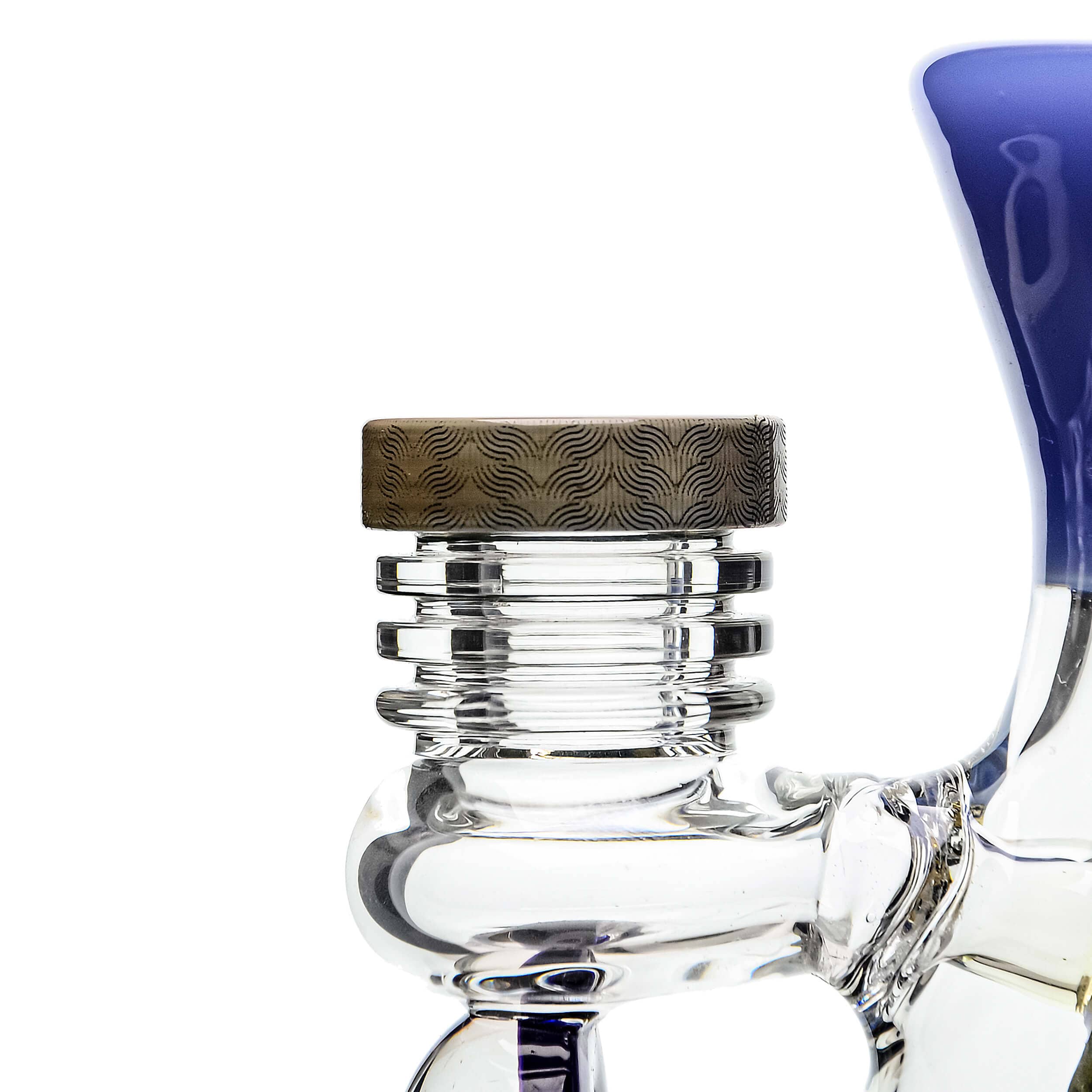 A close-up, angled view of the ETCH DAB RIG V2| showcasing its clear glass construction and detailed etched design.