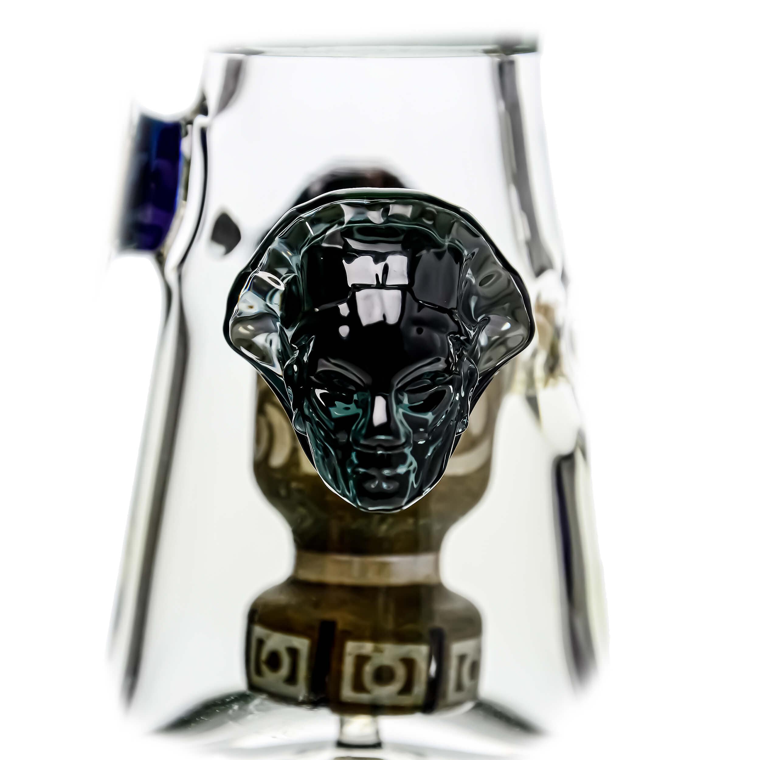 A studio shot of the ETCH DAB RIG-V4| showcasing its clear glass construction and unique sculpted design from a low angle.