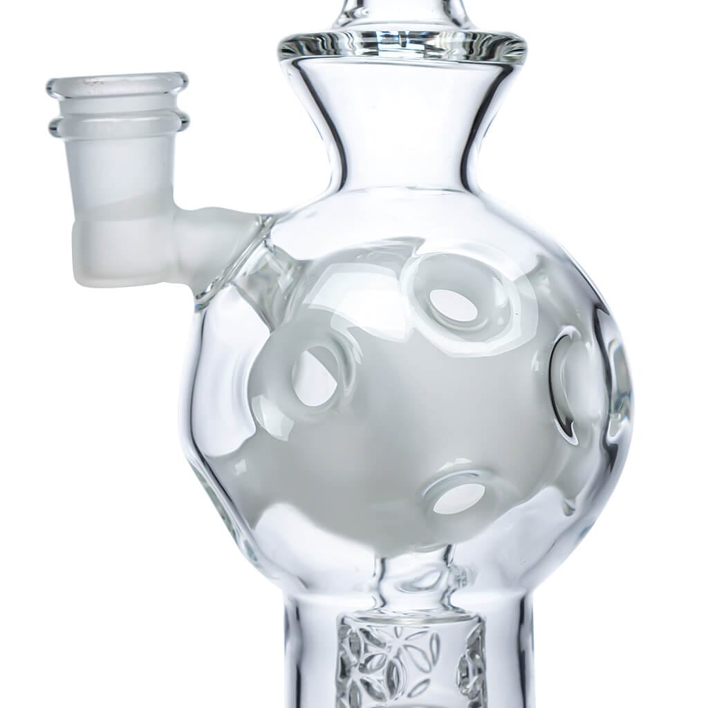 Front view of the EXOSPHERE, a clear glass water pipe with a patterned base and simple cylindrical shape.