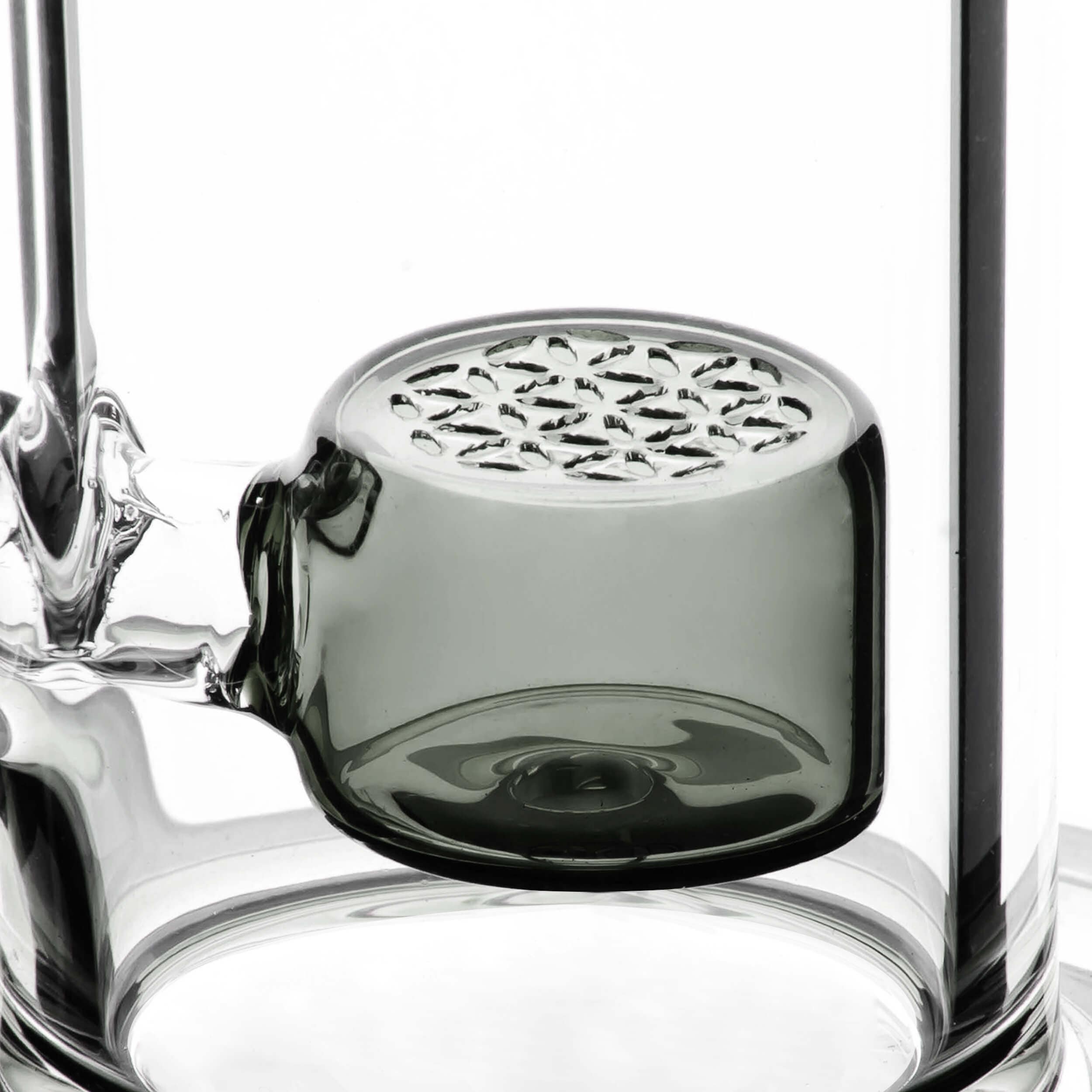 A close-up view of the NATTY BONG, showcasing its clear glass construction and rounded base.