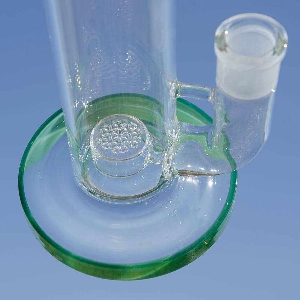 A close-up, angled view of the NATTY BONG, showing the clear glass construction and circular base.