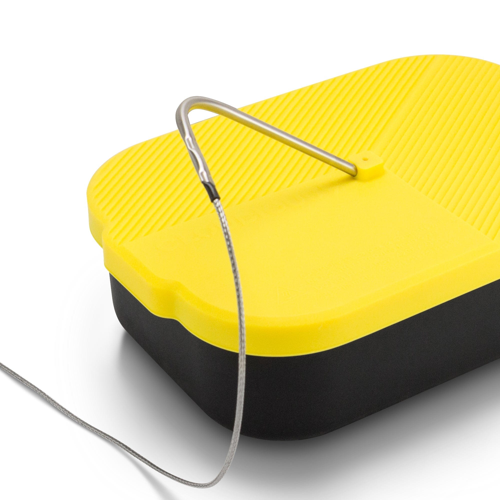 A top-down view of the Decarb9 Herbal Decarboxylator Kit, showcasing its silver heating element against a yellow surface.