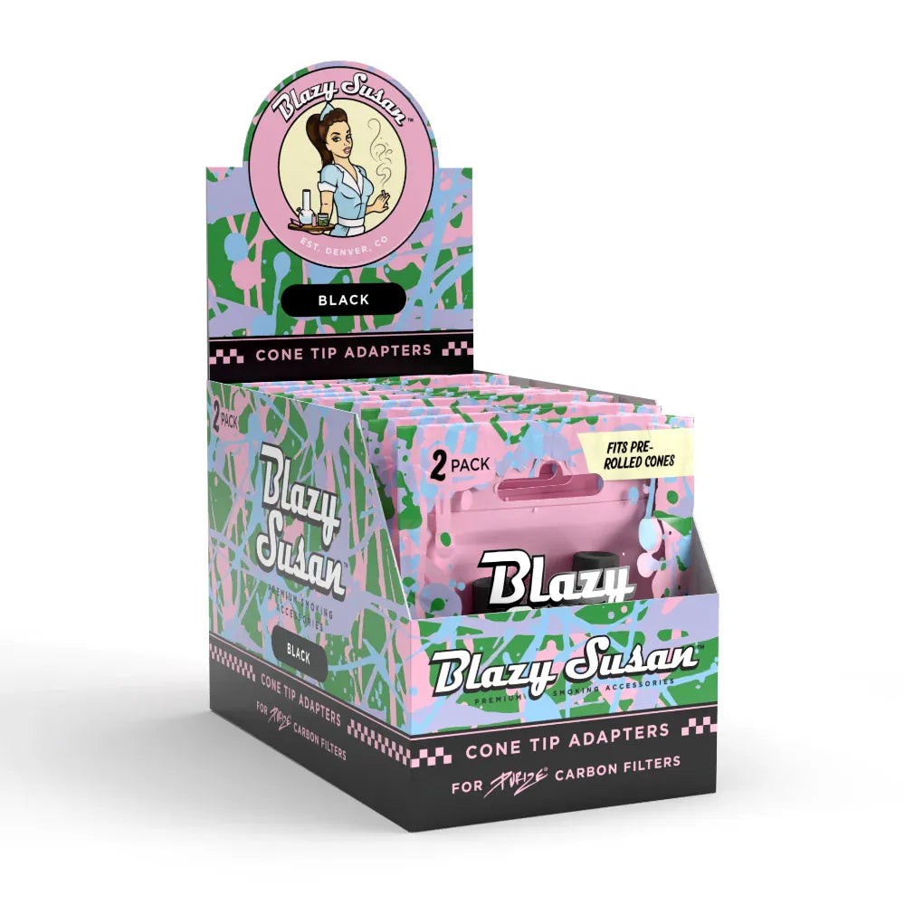Three-quarter front view of a colorful counter display box of Blazy Susan Purize Cone Tip Adapters showing stacked pink-and-green patterned retail packs and a round logo header.