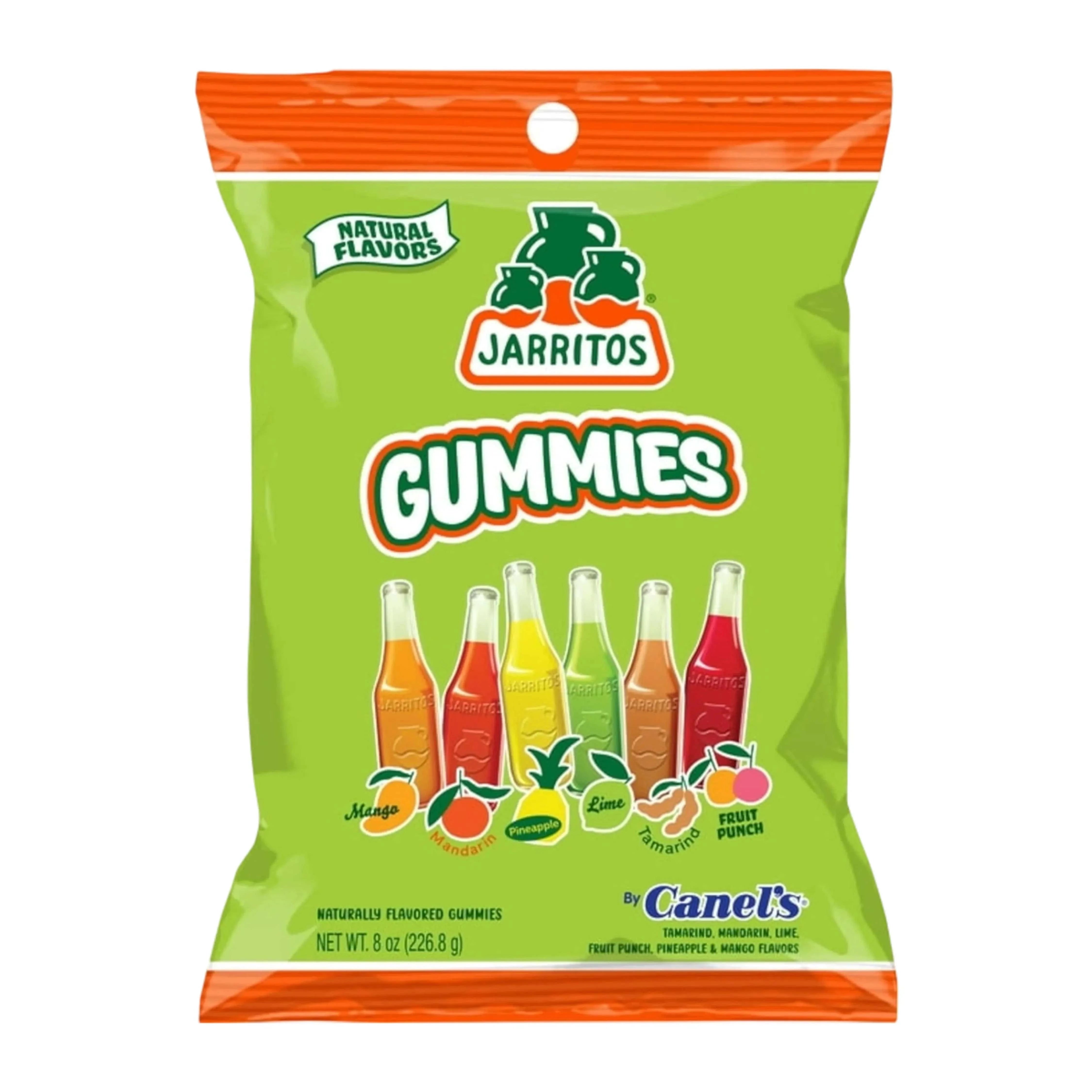 Top-centered view of a bright green bag of Jarritos Bottle Gummies showing colorful soda bottle illustrations and the orange-striped header.