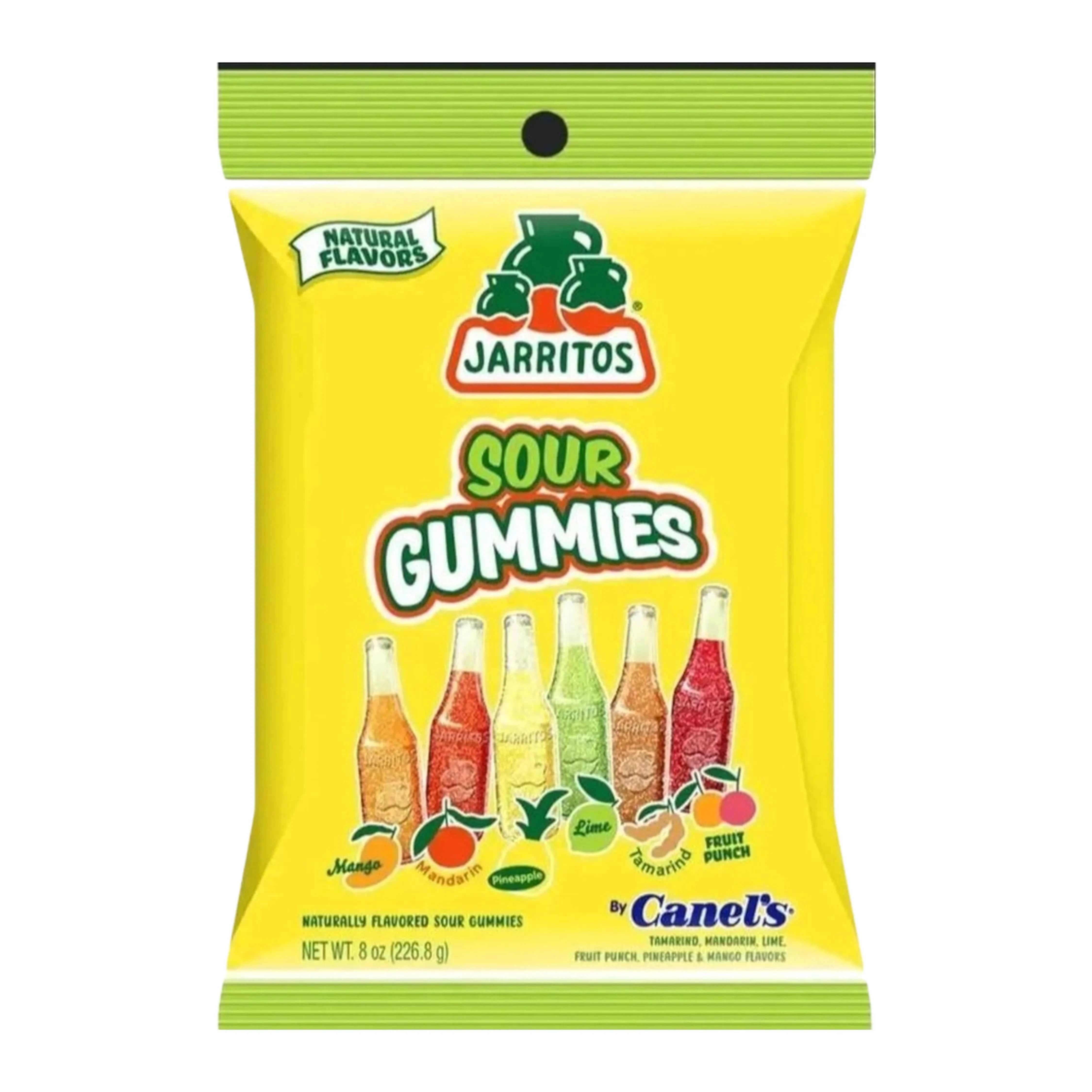 Bright front-facing shot of a yellow bag of Jarritos Bottle Sour Gummies showing stacked bottle-shaped gummies and colorful fruit icons.