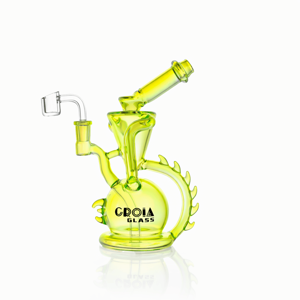 Angled front view of the neon yellow Croia Glass 10" Dragon Spine Recycler Dab Rig against a white background.