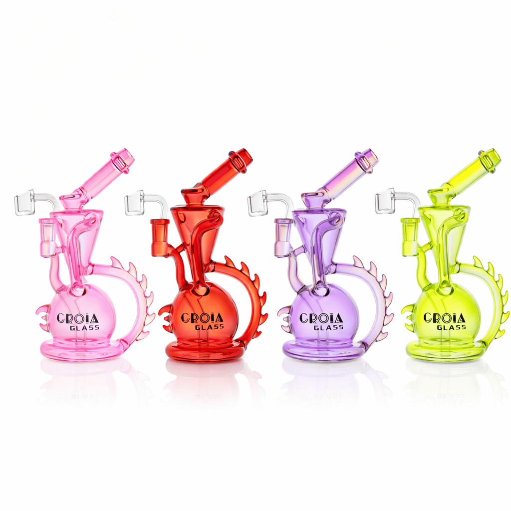 Row of four colorful Croia Glass 10" Dragon Spine Recycler Dab Rig | Croia Glass pieces in pink, red, purple, and lime on white, front view.
