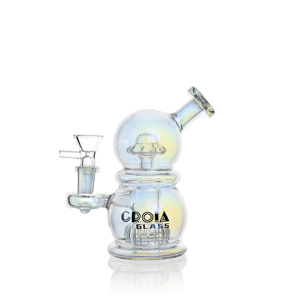Front three-quarter view of the iridescent Croia Glass 6" Mini Egg Dab Rig with Crown Perc showing its double-bubble body, angled mouthpiece, side bowl, and subtle rainbow reflections.