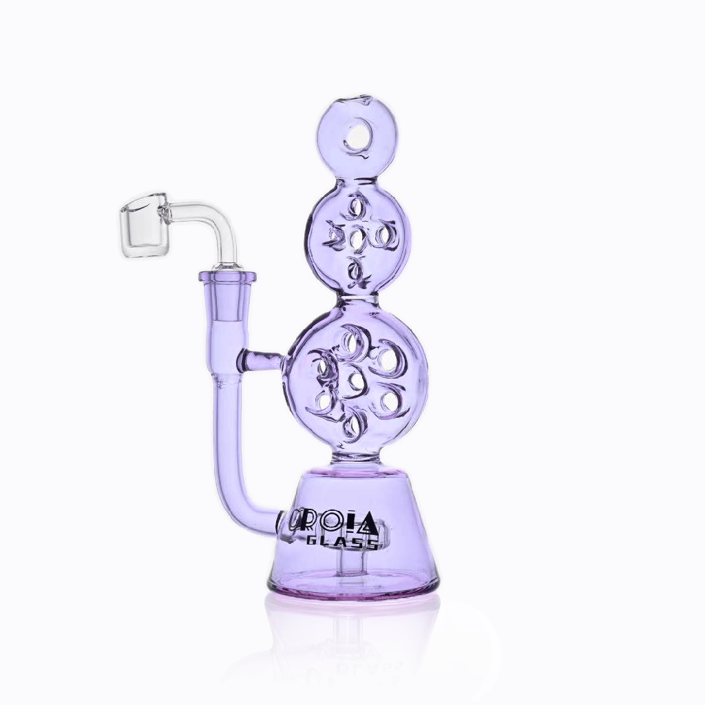 Front-facing shot of the Croia Glass 8" Triple Stack Swiss Perc Recycler Dab Rig | Croia Glass in light purple glass with stacked spherical chambers and a reflective white background