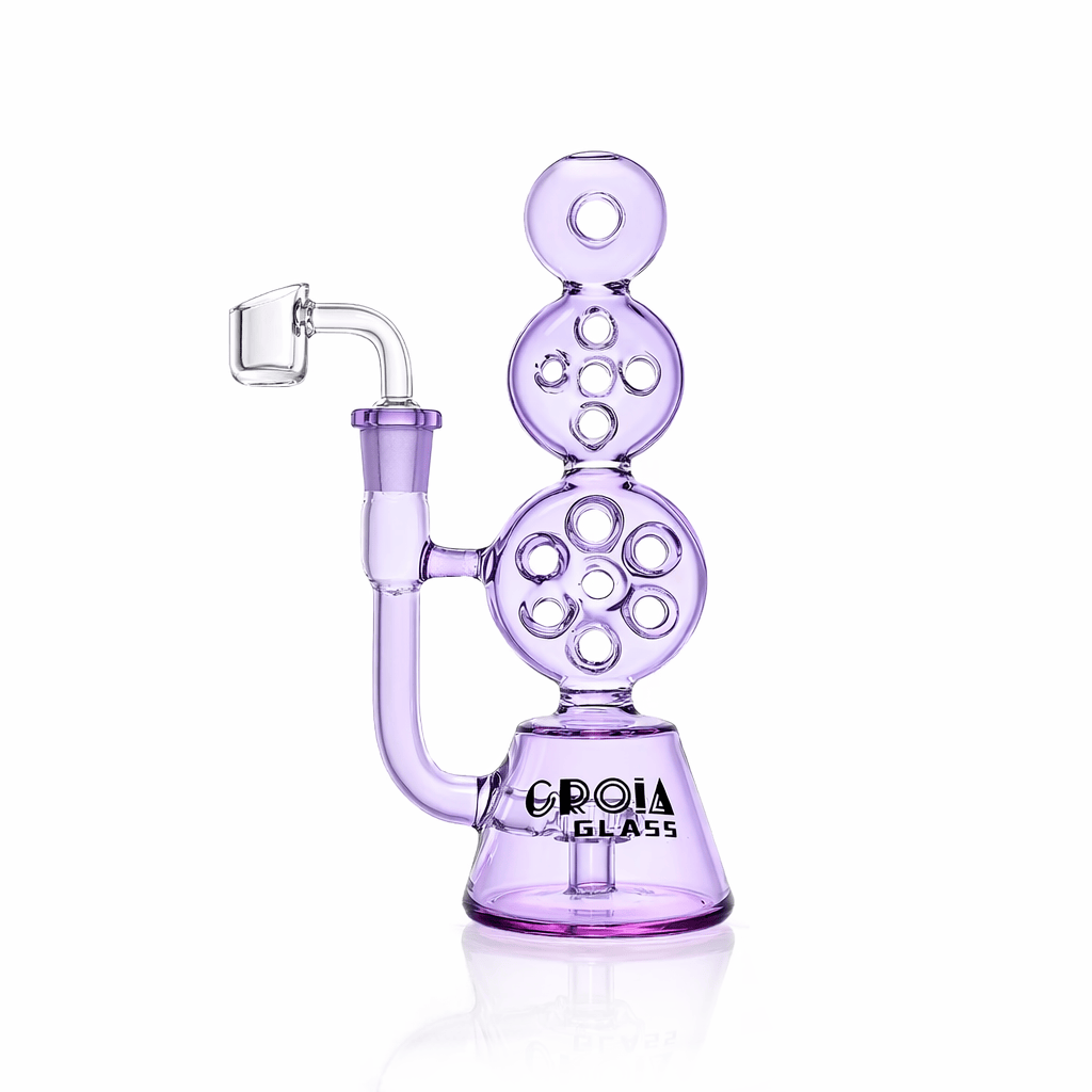 Studio-front view of the Croia Glass 8" Triple Stack Swiss Perc Recycler Dab Rig | Croia Glass in translucent lavender glass showing its stacked circular percs and angled banger.