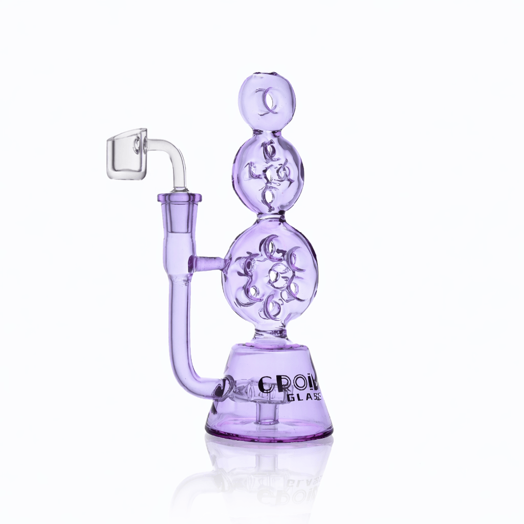 Side view of the lavender Croia Glass 8" Triple Stack Swiss Perc Recycler Dab Rig | Croia Glass showing three stacked spherical chambers and a clear banger on a white reflective background