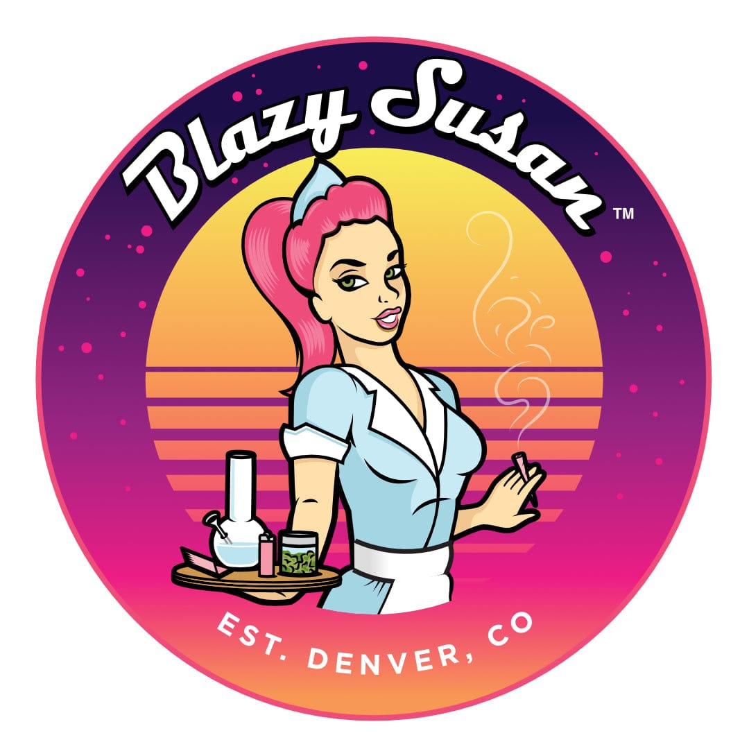 Centered circular logo showing a retro waitress holding a tray with a bong and jar against a pink-orange sunset, labeled Blazy Susan 8" Silicone Tray Mat.