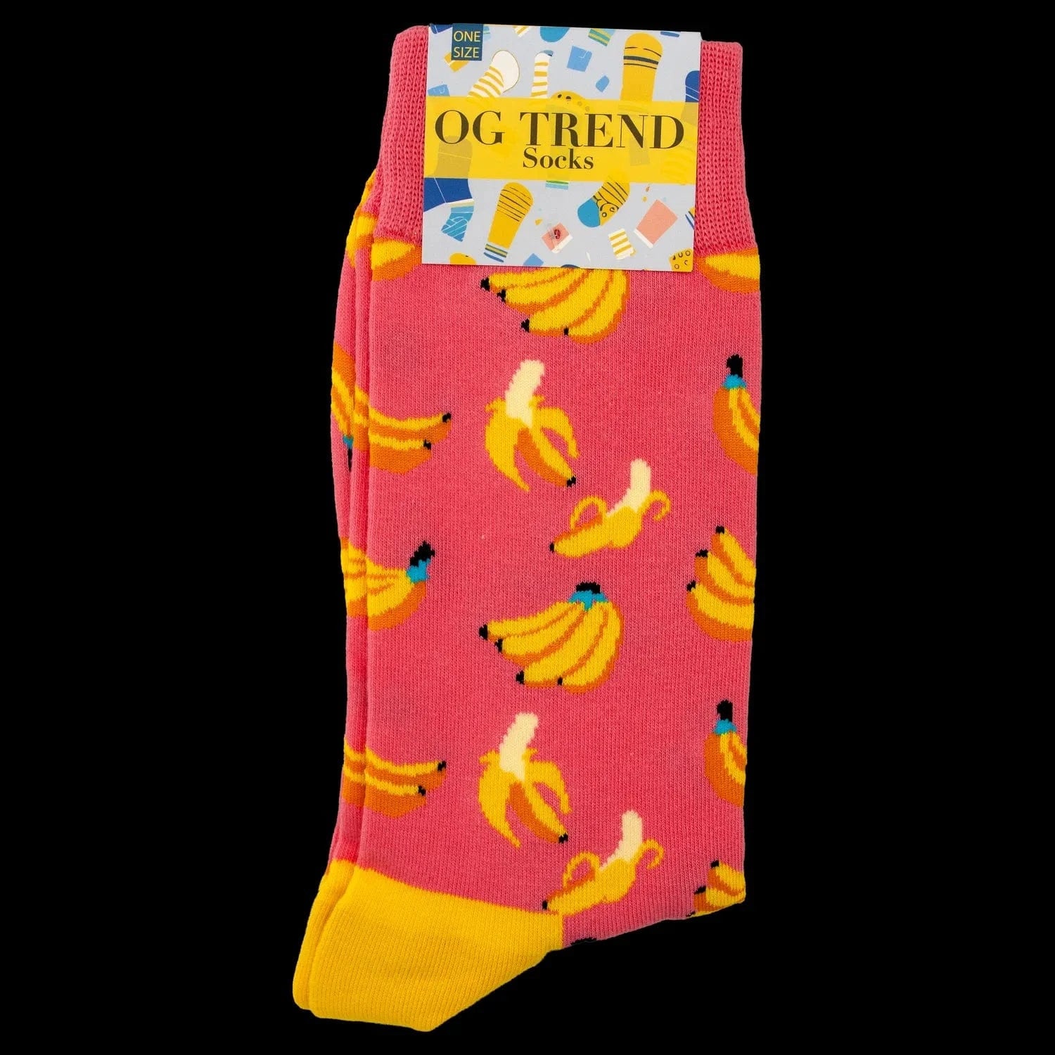 Close-up front view of the Pink Banana Socks - One Size Fits All folded to show a pink knit with repeated yellow banana motifs and a contrasting yellow toe against a black background