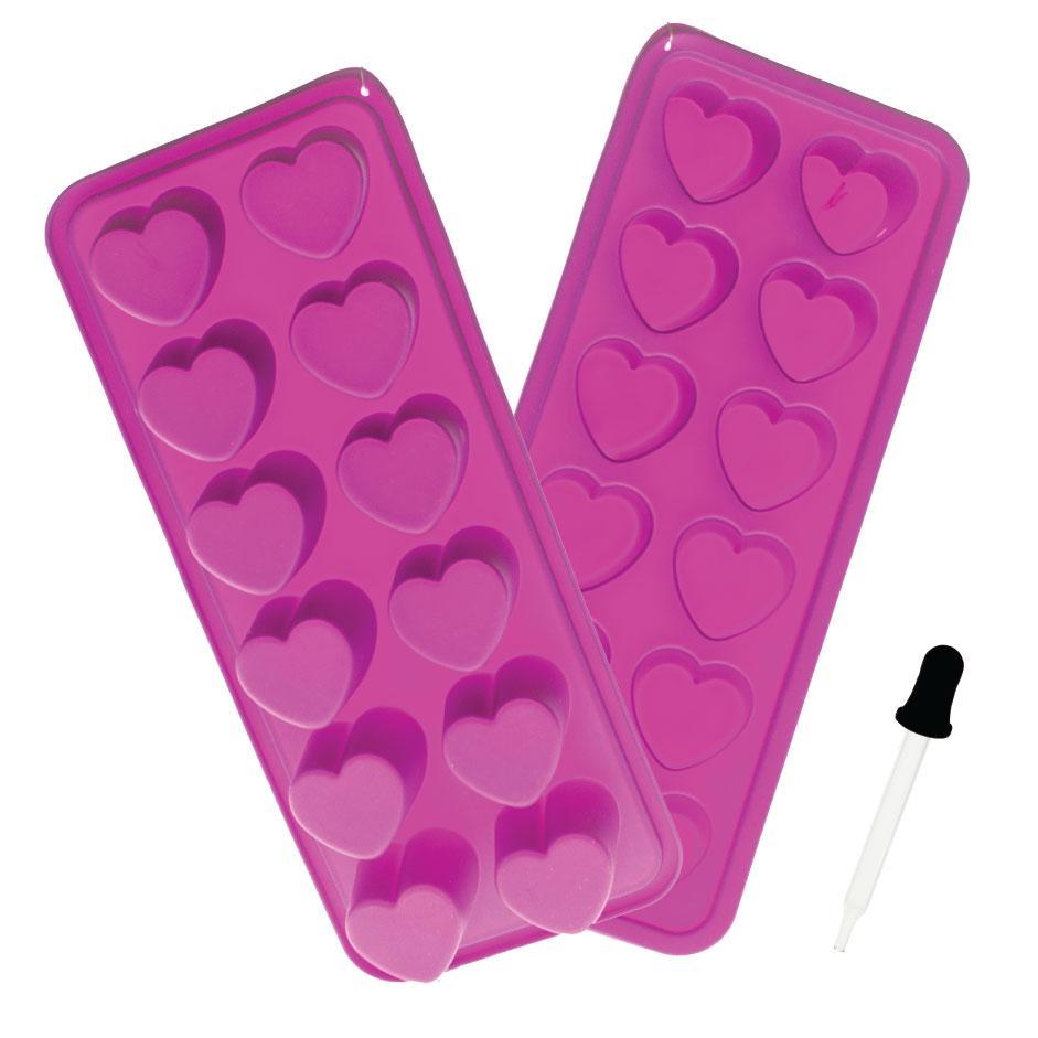 Pink silicone heart-shaped ice cube trays with a dropper for cannabis concentrates.
