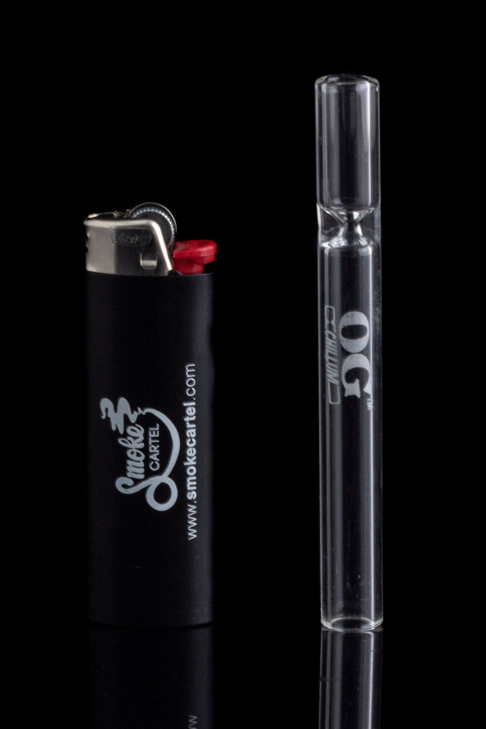 A clear glass OG Clear Chillum stands on a reflective surface, viewed from a low angle with a lighter nearby.