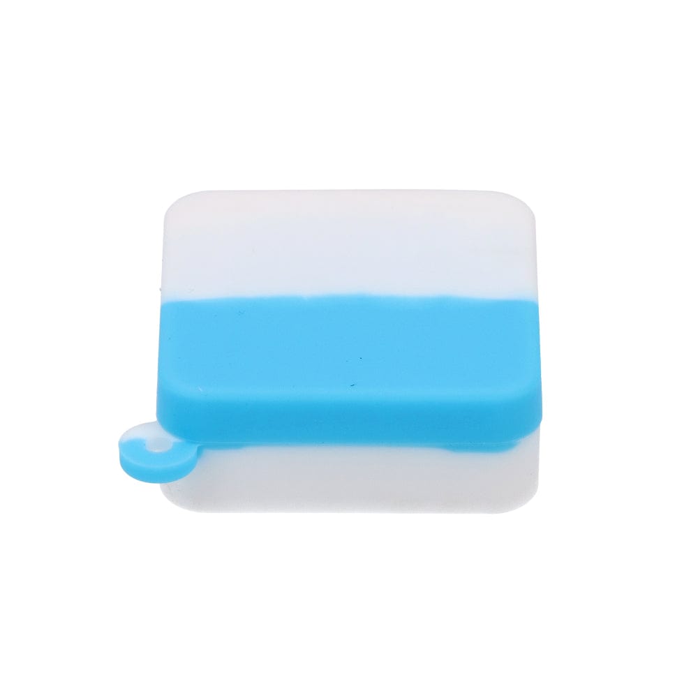 A top-down view of the Silicone Keychain Container Square 9ml, showcasing its translucent, square shape on a reflective surface.