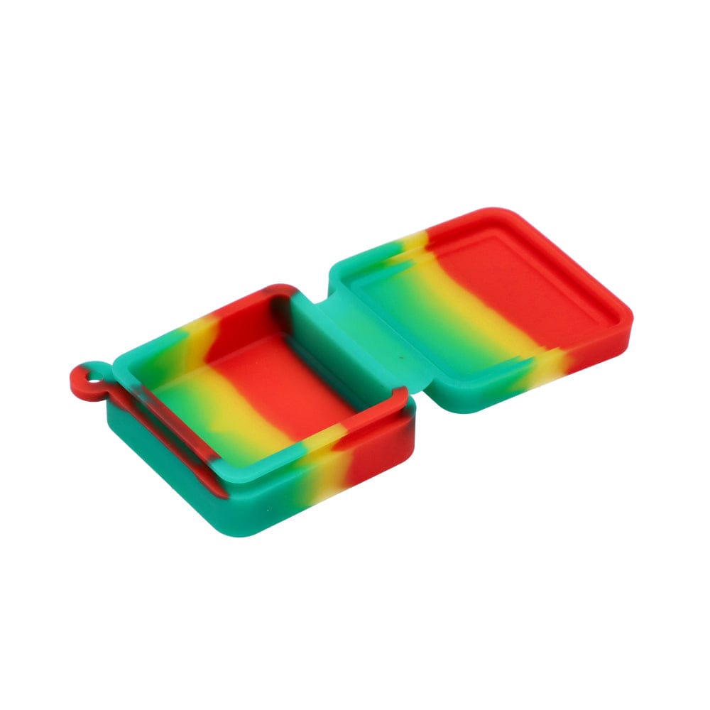 The open Silicone Keychain Container Square 9ml is shown at an angle, revealing its empty, colorful interior.