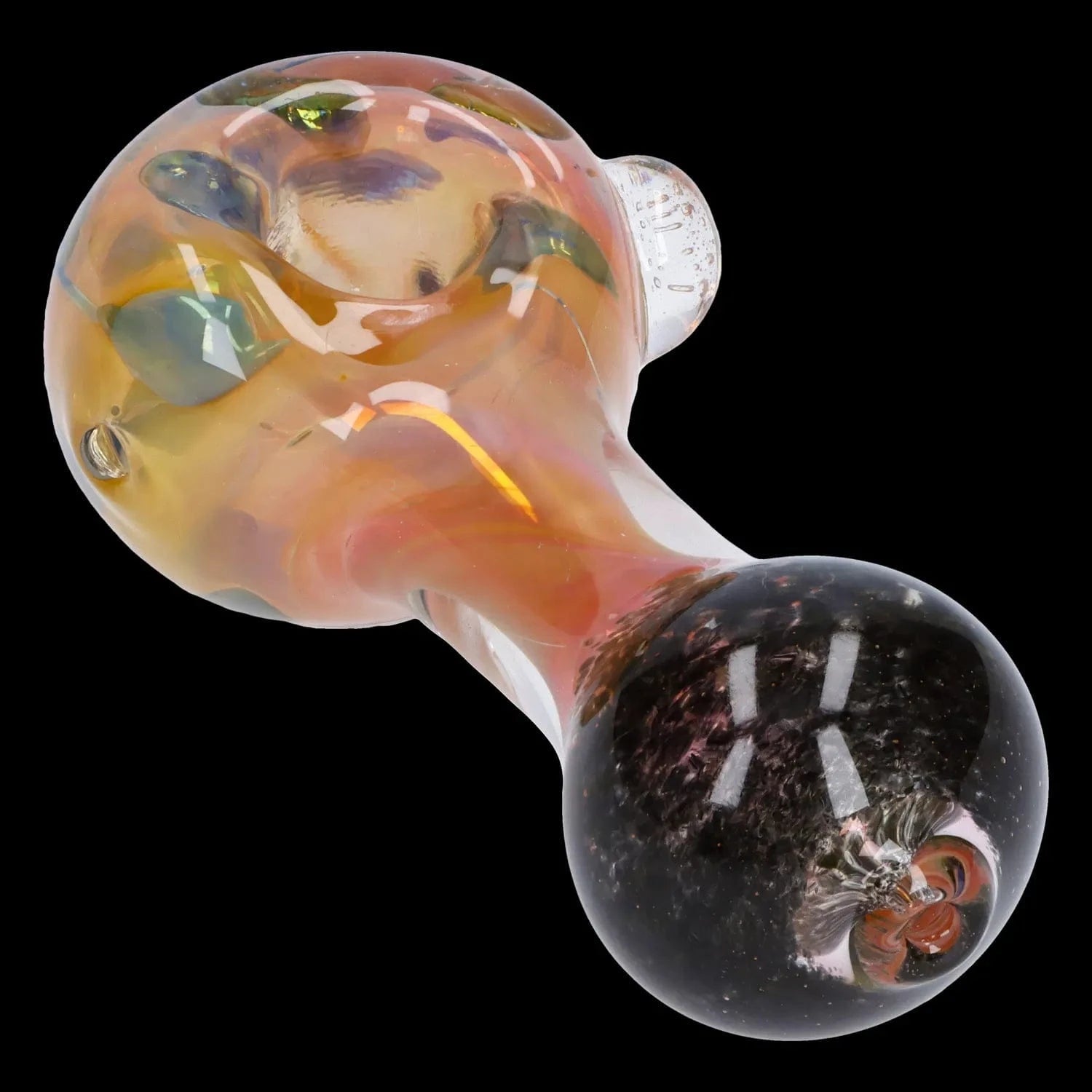 Angled close-up of the Gold and Frit Spoon Pipe - 4 in showing its iridescent amber bowl with green frit accents and a clear rounded mouthpiece
