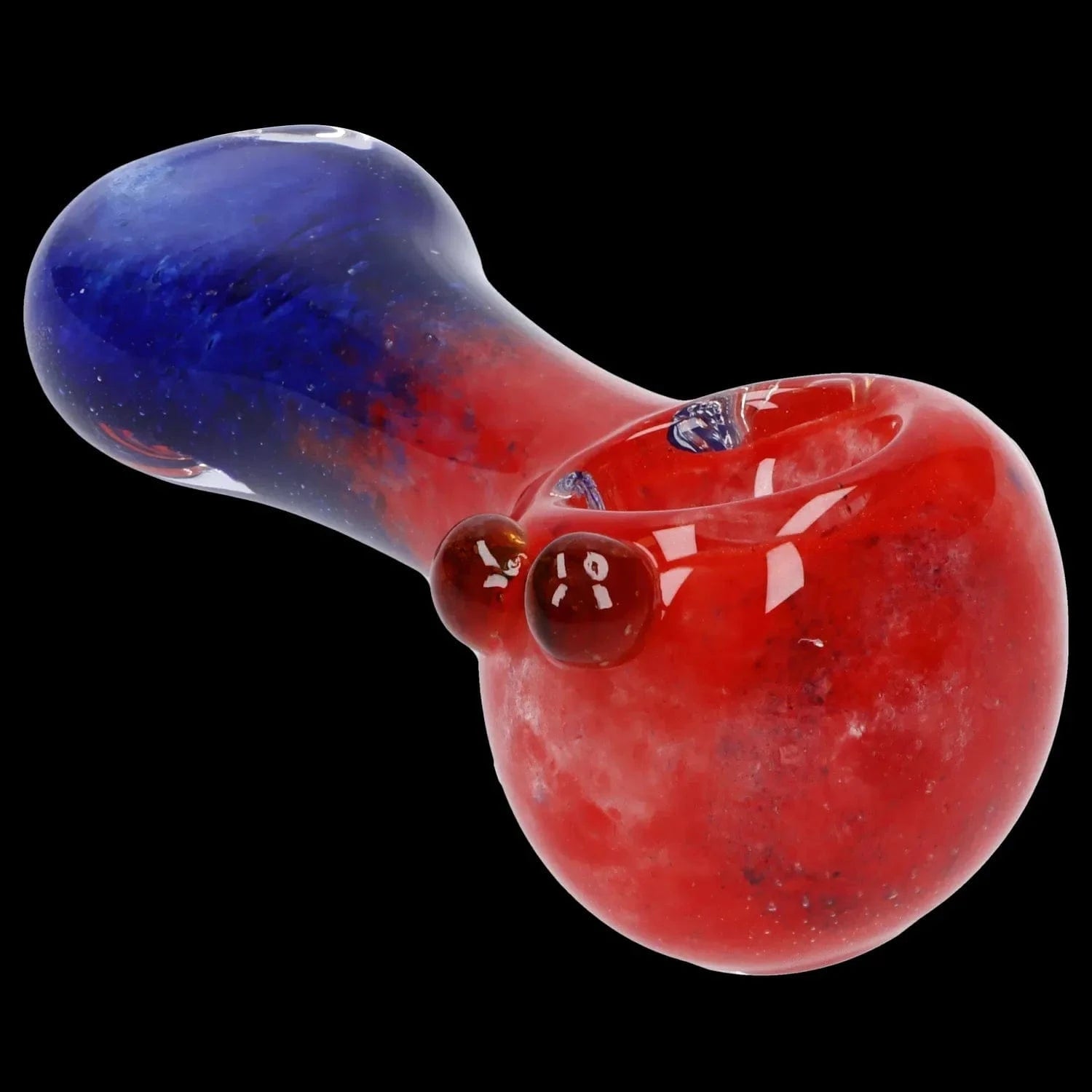Angled close-up of the Gradient Glass Frit Pipe - 3.5 in showing a red bowl fading into a blue mouthpiece with glossy surface highlights against black
