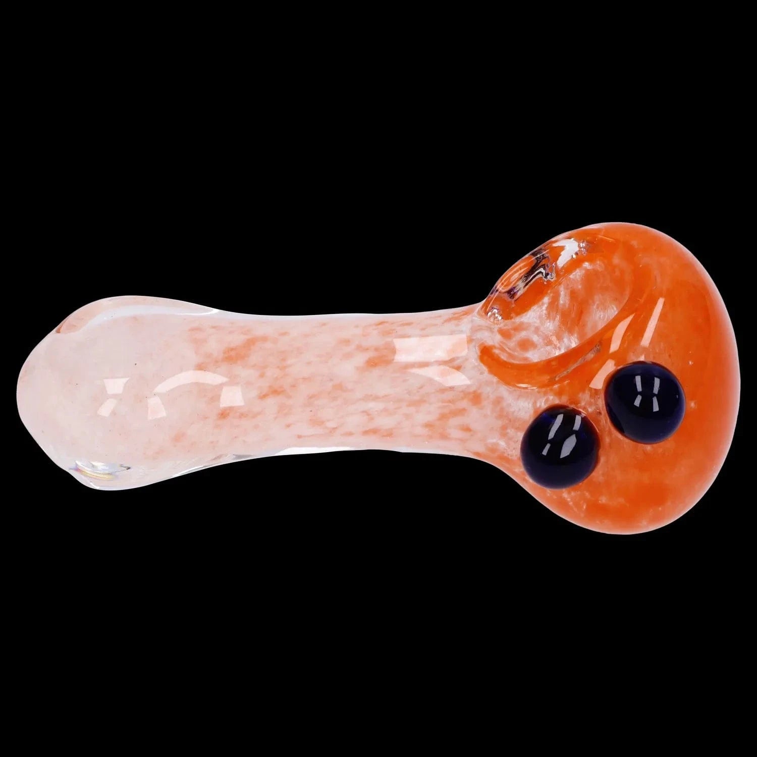 Side view of the Gradient Glass Frit Pipe - 3.5 in showing a mottled pale orange glass body and rounded bowl with two dark blue glass marbles on a black background