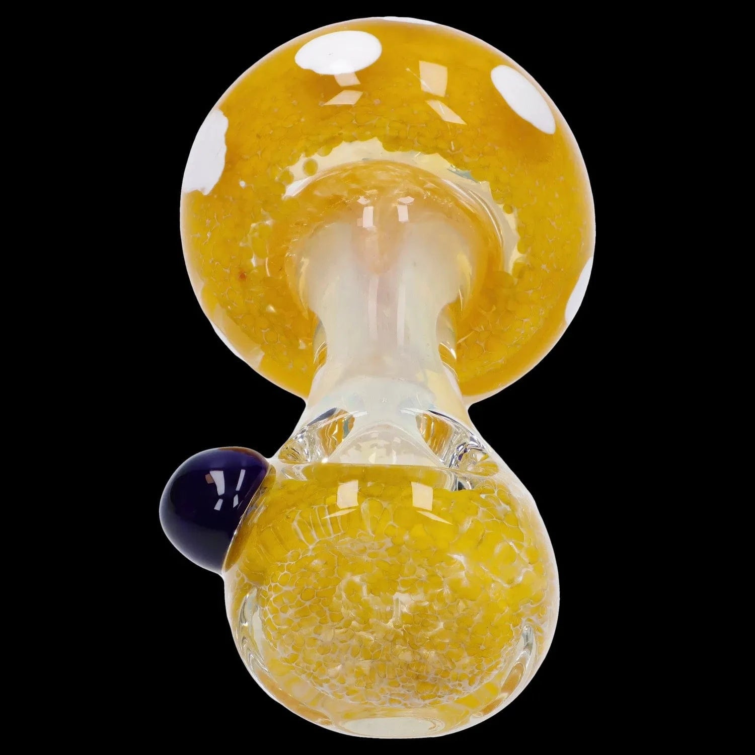 Top-down close-up of the Mushroom Frit Spoon Pipe - 4.5 in showing its glossy yellow frit-patterned bowl and clear glass neck against a black background