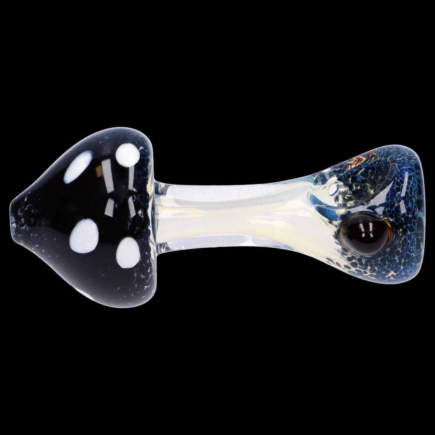 Top-down close-up of a glass Mushroom Frit Spoon Pipe - 4.5 in showing a black mushroom-shaped bowl with white spots and a clear, iridescent stem against a black background