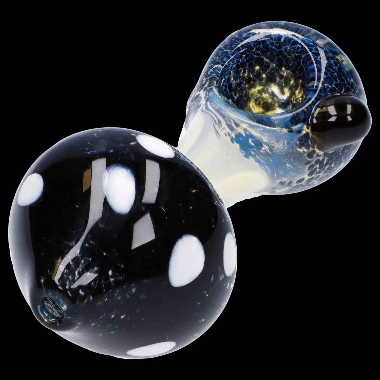 Close-up angled view of the Mushroom Frit Spoon Pipe - 4.5 in showing a black bulbous bowl with white polka dots and a translucent blue-speckled stem against a black background