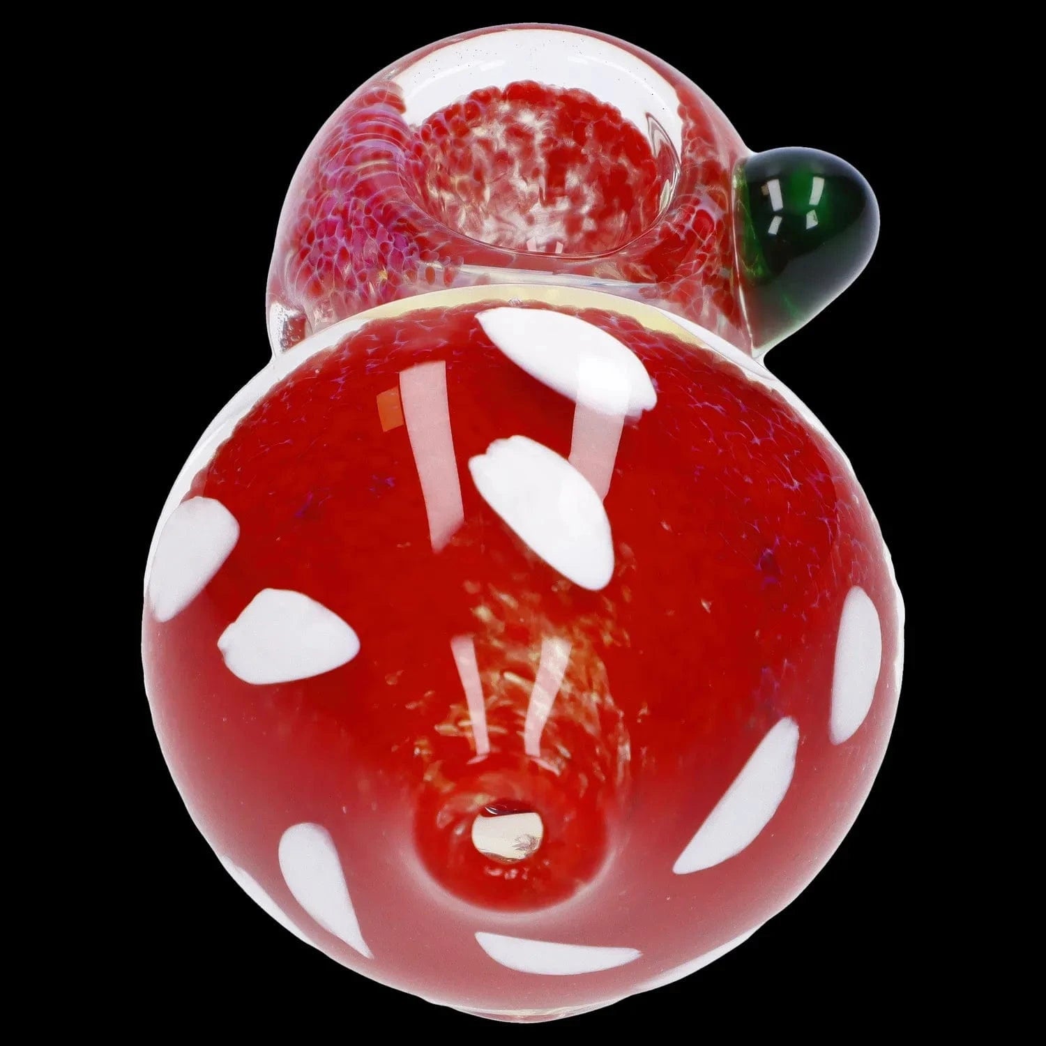 Top-down close-up of the Mushroom Frit Spoon Pipe - 4.5 in showing a glossy red mushroom cap with white spots and a small green bulb on a black background