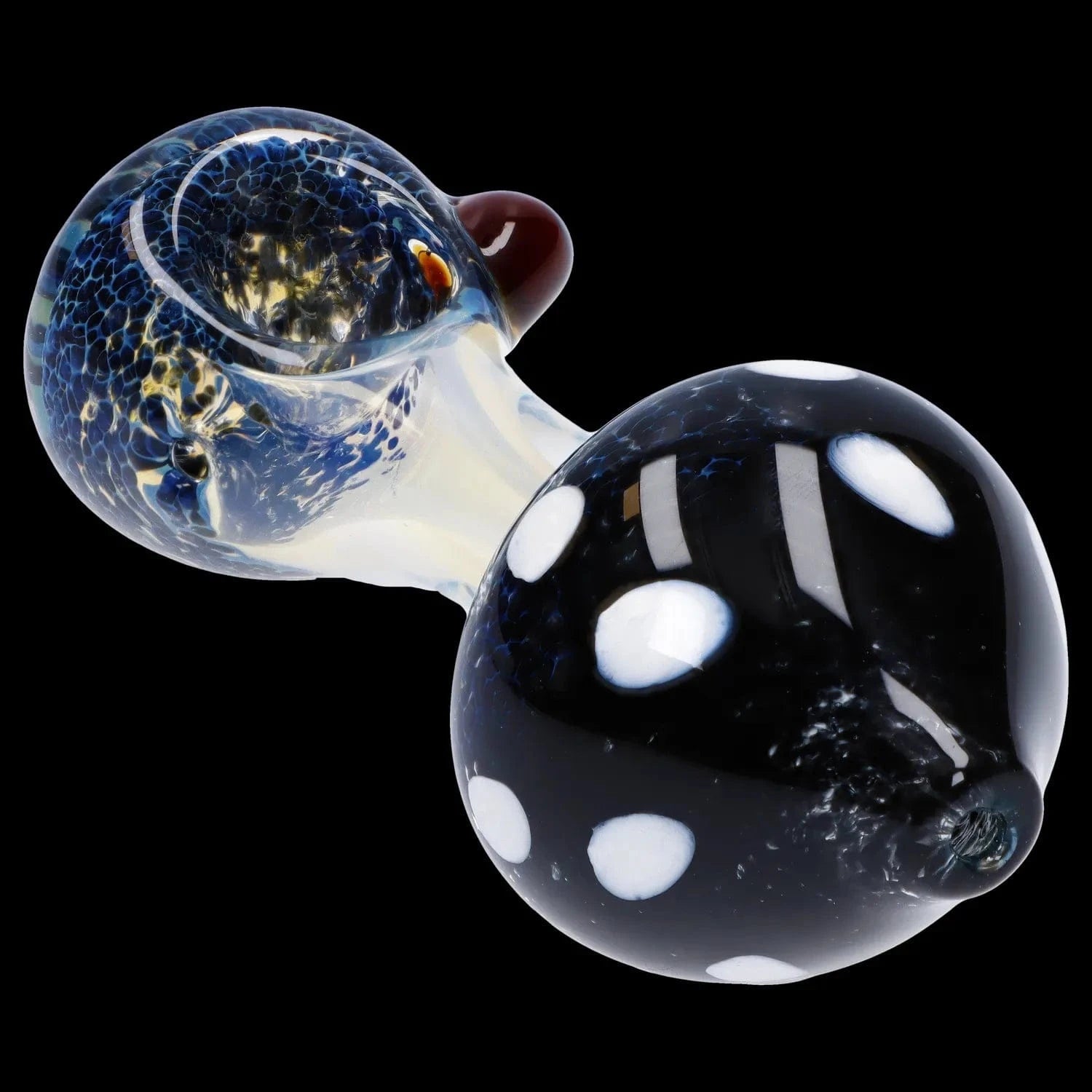 Close-up angled view of the Mushroom Frit Spoon Pipe - 4.5 in showing a speckled blue bowl and black polka-dotted bulb against a black background