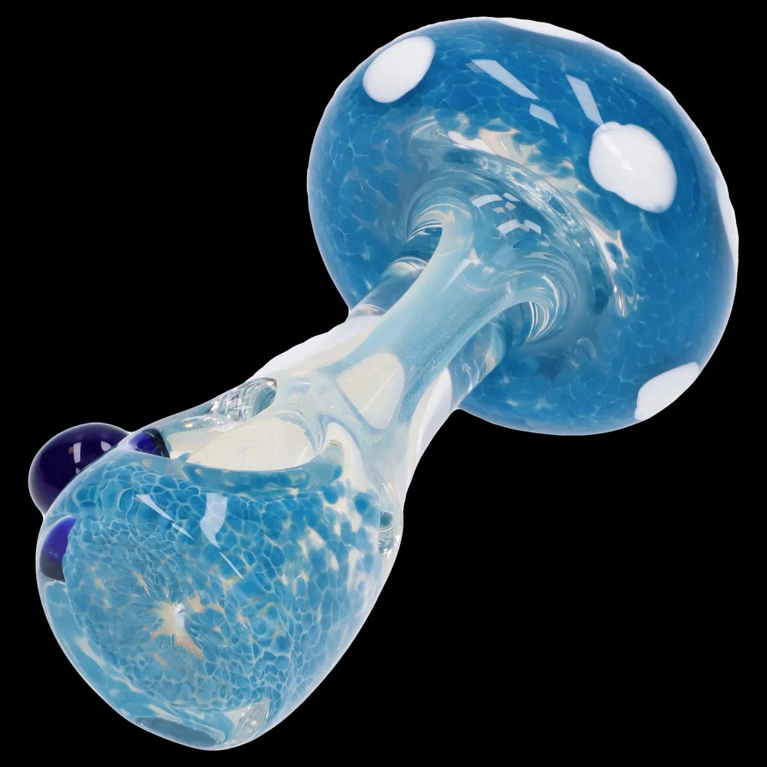 Angled close-up of the blue, spotted Mushroom Frit Spoon Pipe - 4.5 in showing its rounded bowl, swirled neck, and glossy white dot accents against a black background