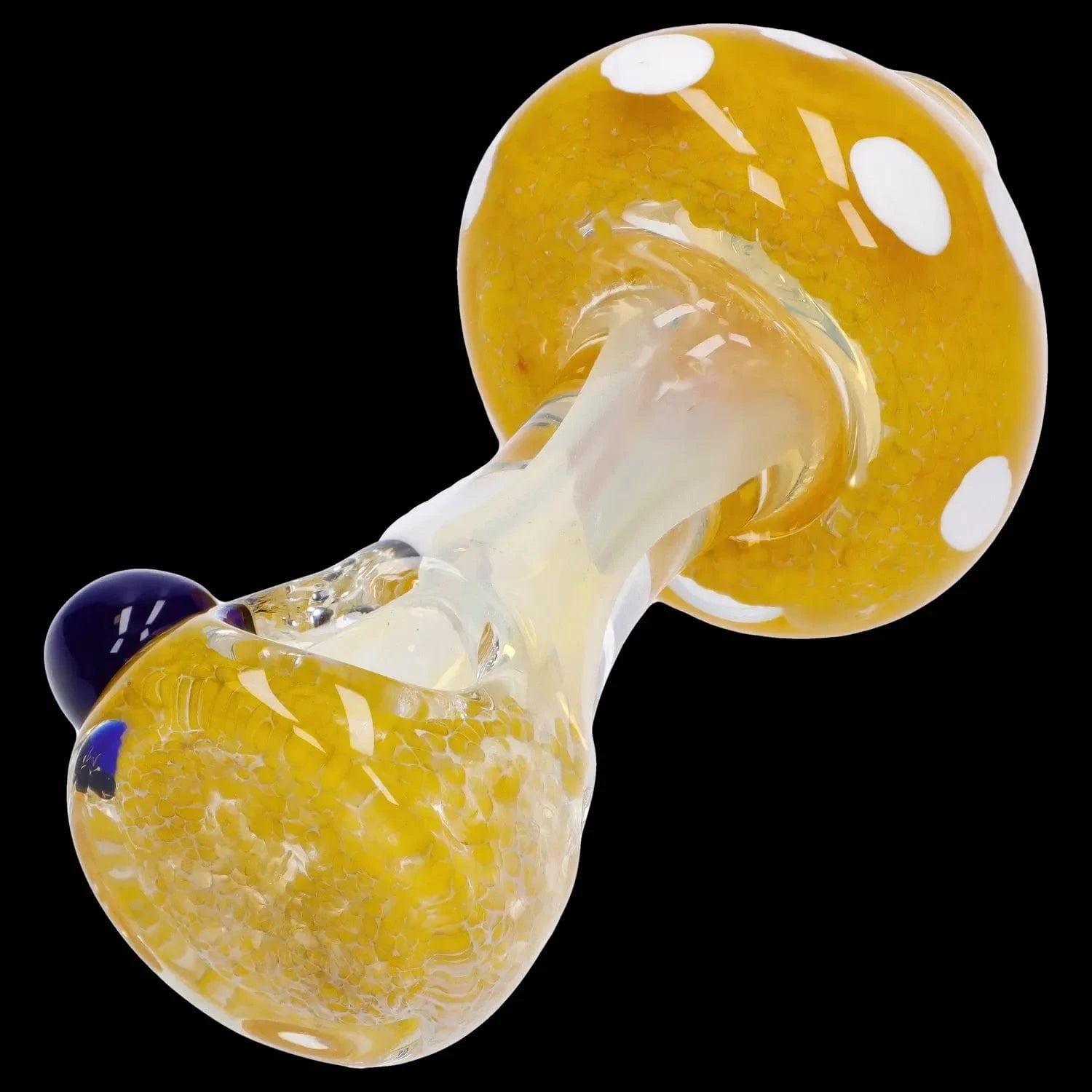 Angled close-up of the Mushroom Frit Spoon Pipe - 4.5 in showing its yellow fritted glass cap with white spots and clear stem against a black background