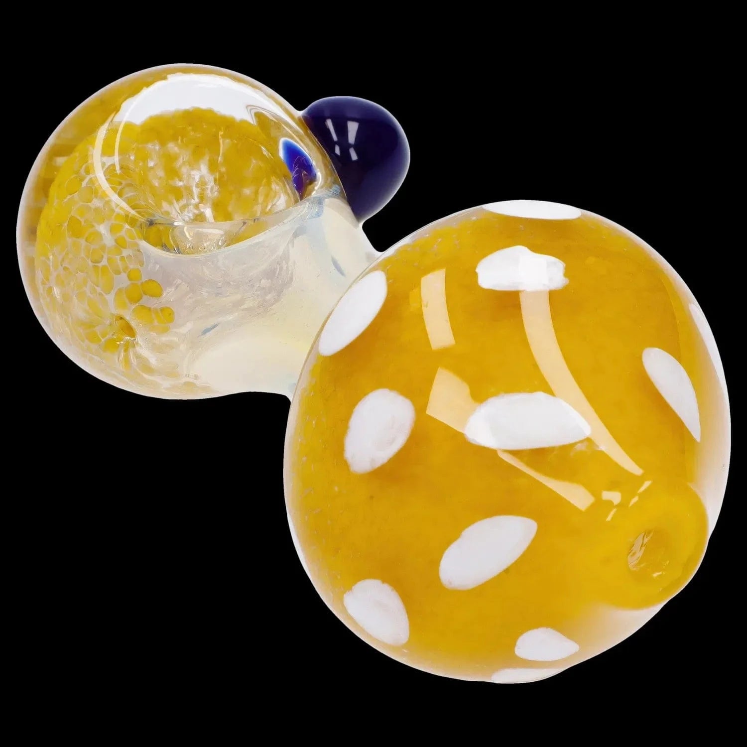 Close-up angled view of the Mushroom Frit Spoon Pipe - 4.5 in showing its yellow, white-spotted mushroom cap and textured glass bowl against a black background