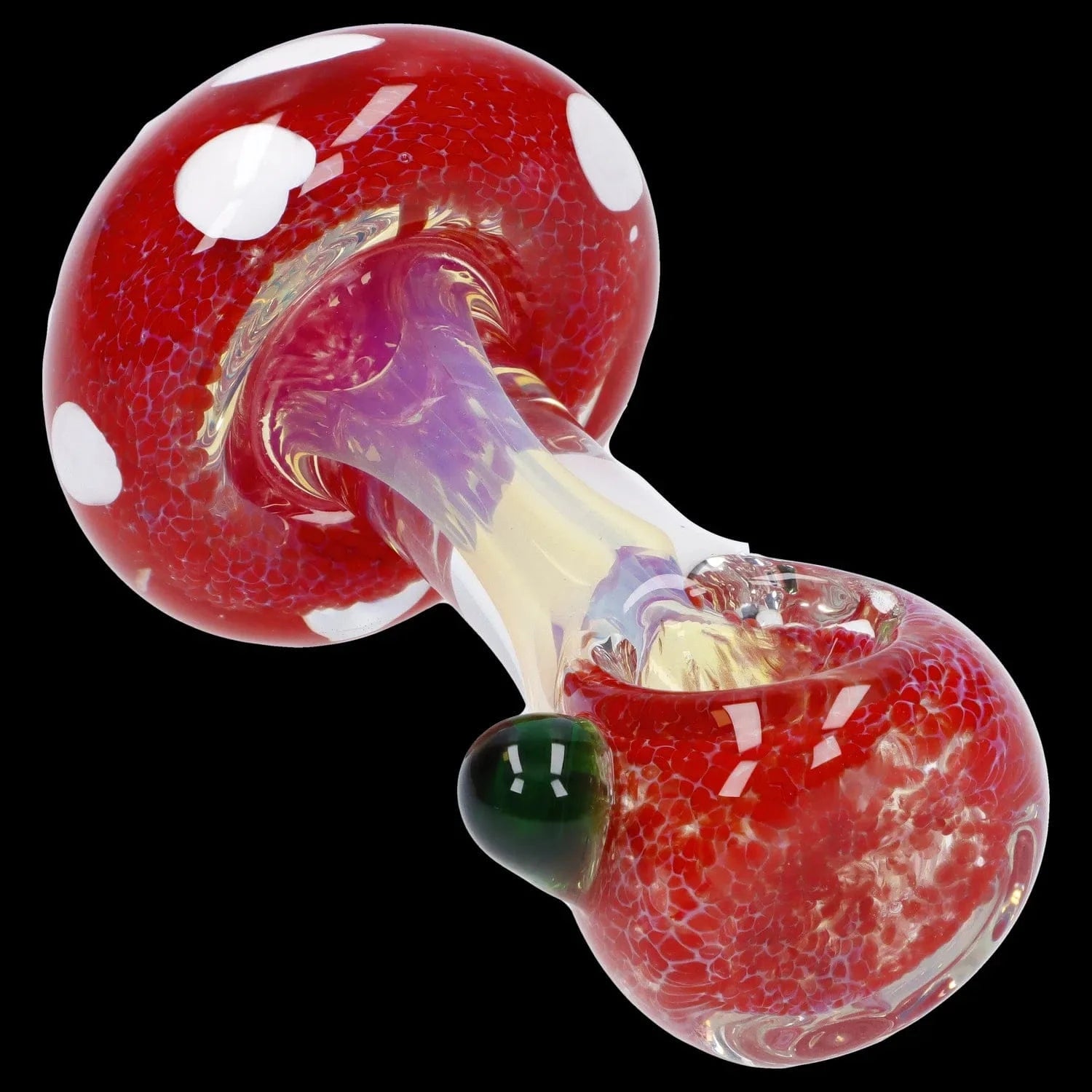 Angled close-up of the Mushroom Frit Spoon Pipe - 4.5 in showing a red, white-spotted mushroom cap and iridescent stem against a black background