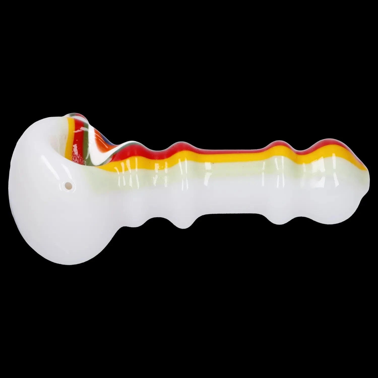 Close-up side view of the Slime Rasta Rainbow Spoon Pipe - 4.5 in, showing a white glass spoon with rasta red-yellow-green striping along its ridged top against a black background