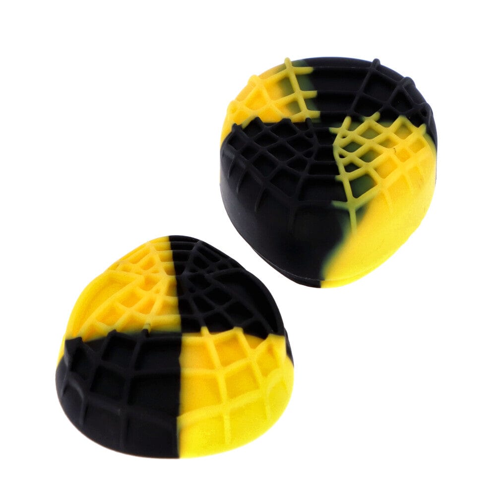 Angled top view of two pink blue Silicone Teardrop Container pieces in yellow and black with textured grid surfaces on a white background
